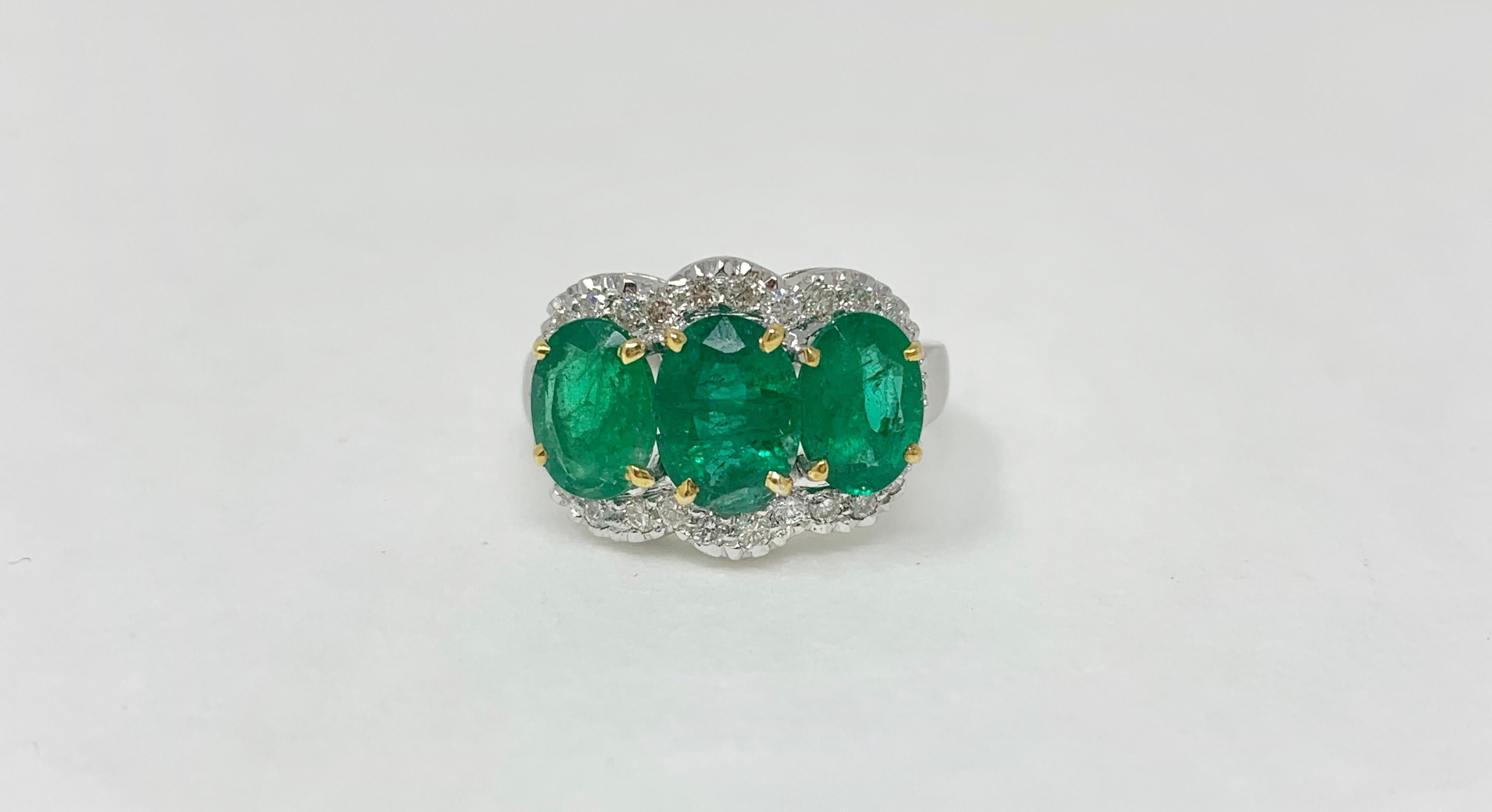 Moguldiam Inc three stone oval emerald and diamond ring is custom handmade in 18 k white gold. 
Emerald weight : 3.52 carat 
Diamond weight : 0.51 carat
Gold : 6.900 grams 
Ring size : 7 and can be sized