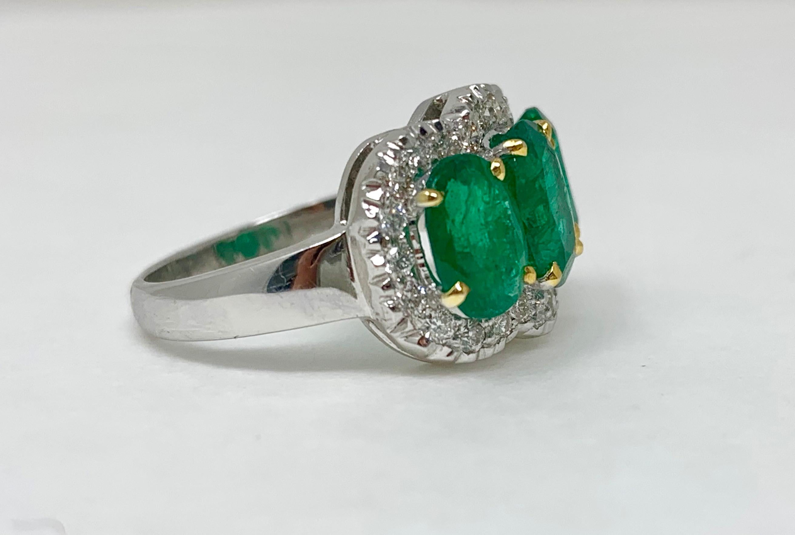 Contemporary Three-Stone Oval Emerald and Diamond Ring in 18 Karat White Gold