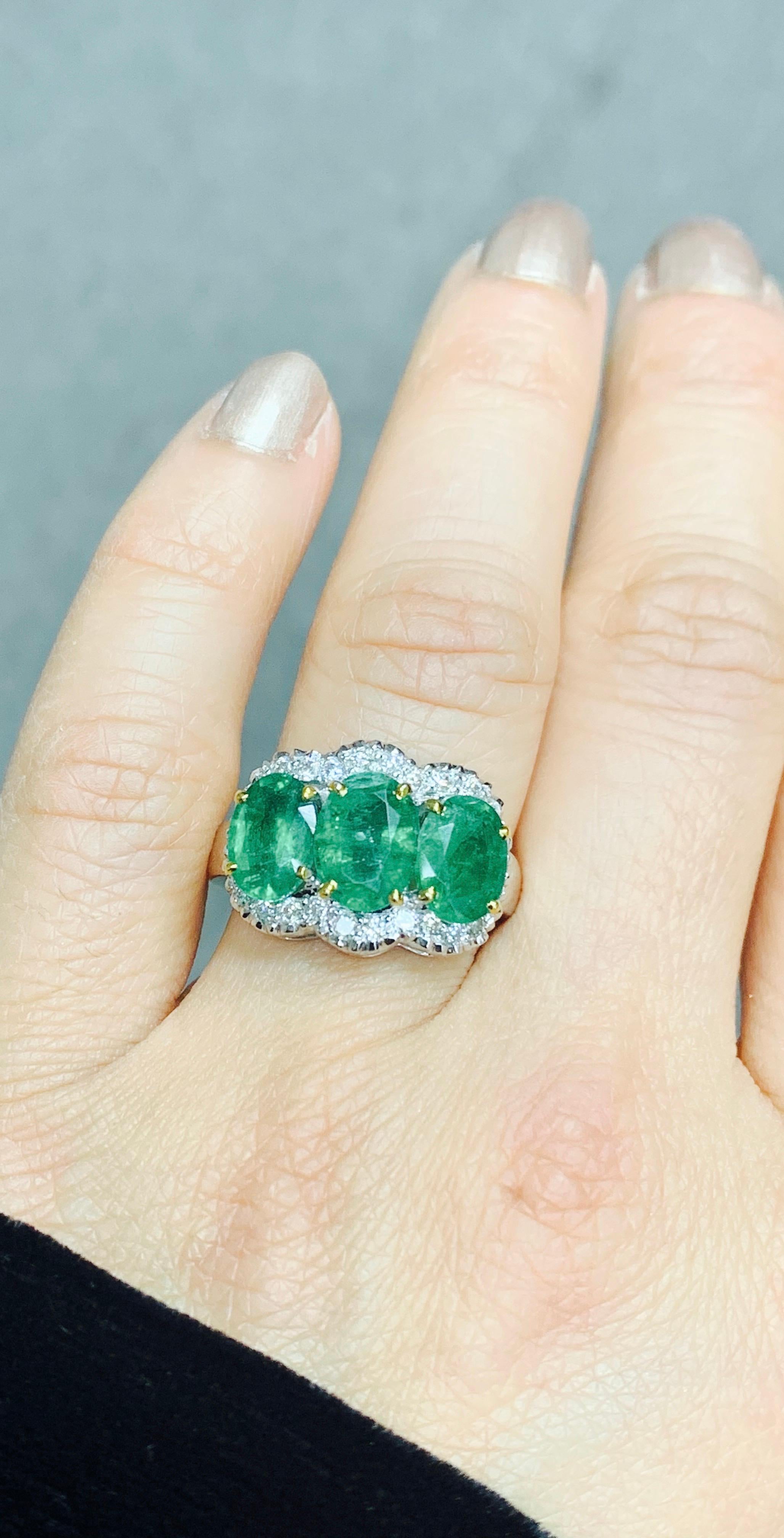 Three-Stone Oval Emerald and Diamond Ring in 18 Karat White Gold In New Condition In New York, NY