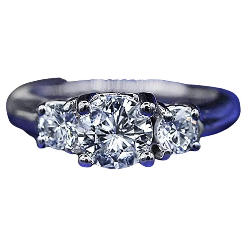 For Sale:  Three-Stone Platinum Engagement Ring with 1.00ct Center Round Diamond
