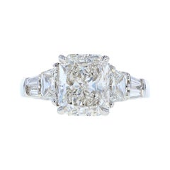Three -Stone Radiant Cut Diamond Engagement Ring with Trapezoid Side Stones