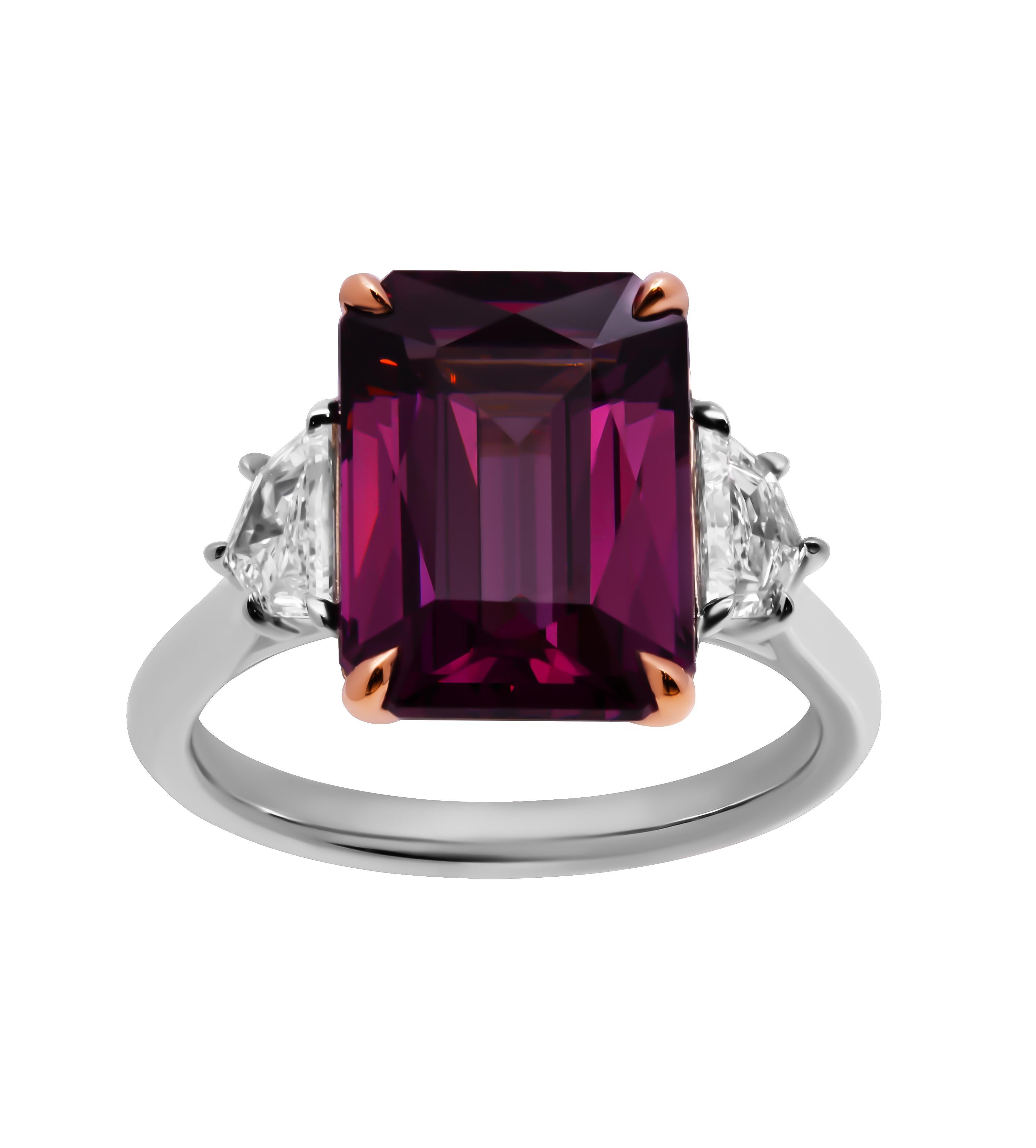 Three stone ring in 18K Rose Gold and Platinum 

Featuring Center Stone: 7.05ct Burgundy - Purple garnet

Side stones are GIA Certified Natural Diamonds:

0.32ct D VVS1 GIA#1479195210 Cadillac cut diamond
0.30ct D VVS2 GIA#7472371518 Cadillac cut