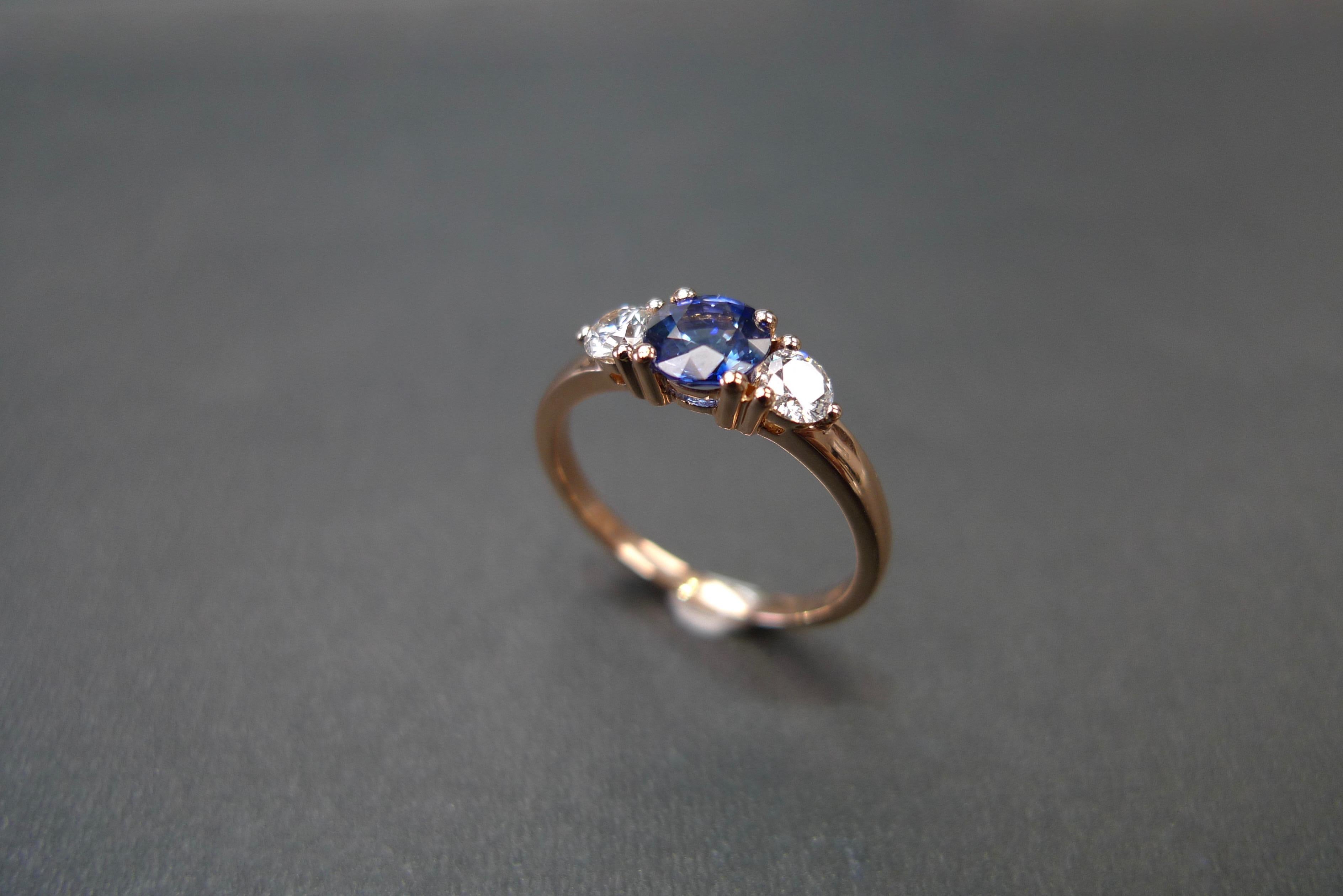 For Sale:  Three-Stone Ring with Blue Sapphire and Round Brilliant Cut Diamond in Rose Gold 11