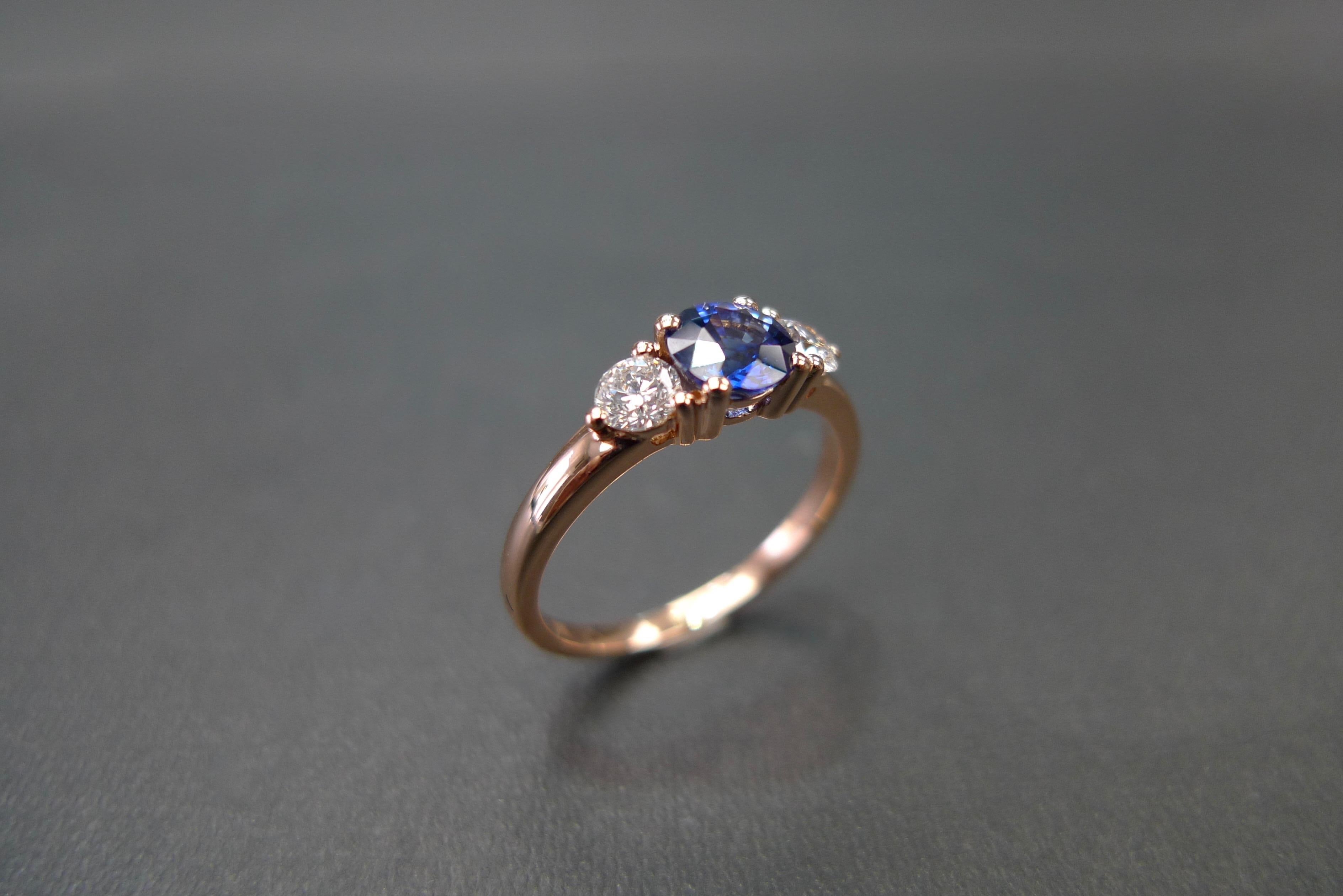 For Sale:  Three-Stone Ring with Blue Sapphire and Round Brilliant Cut Diamond in Rose Gold 13