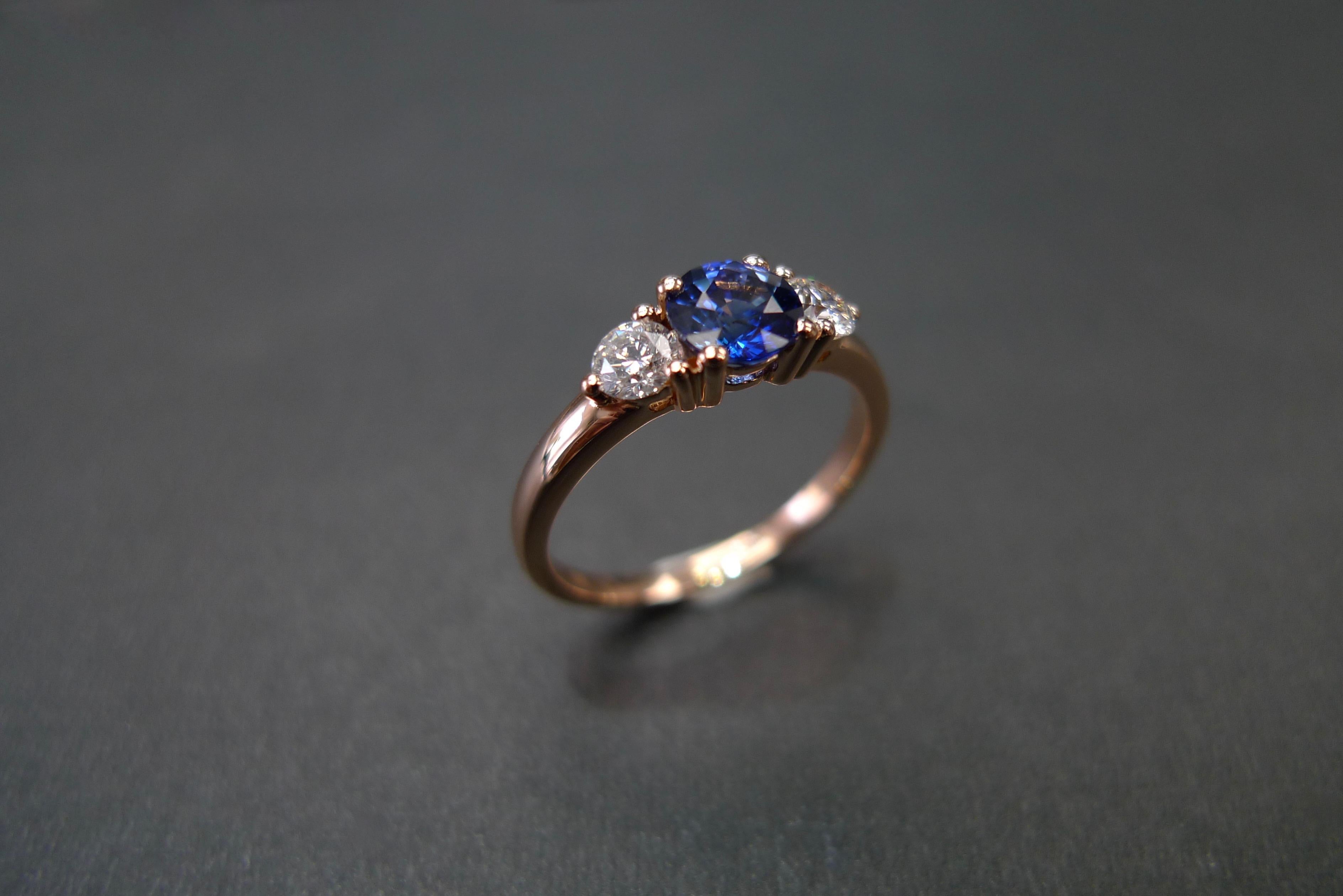 For Sale:  Three-Stone Ring with Blue Sapphire and Round Brilliant Cut Diamond in Rose Gold 5