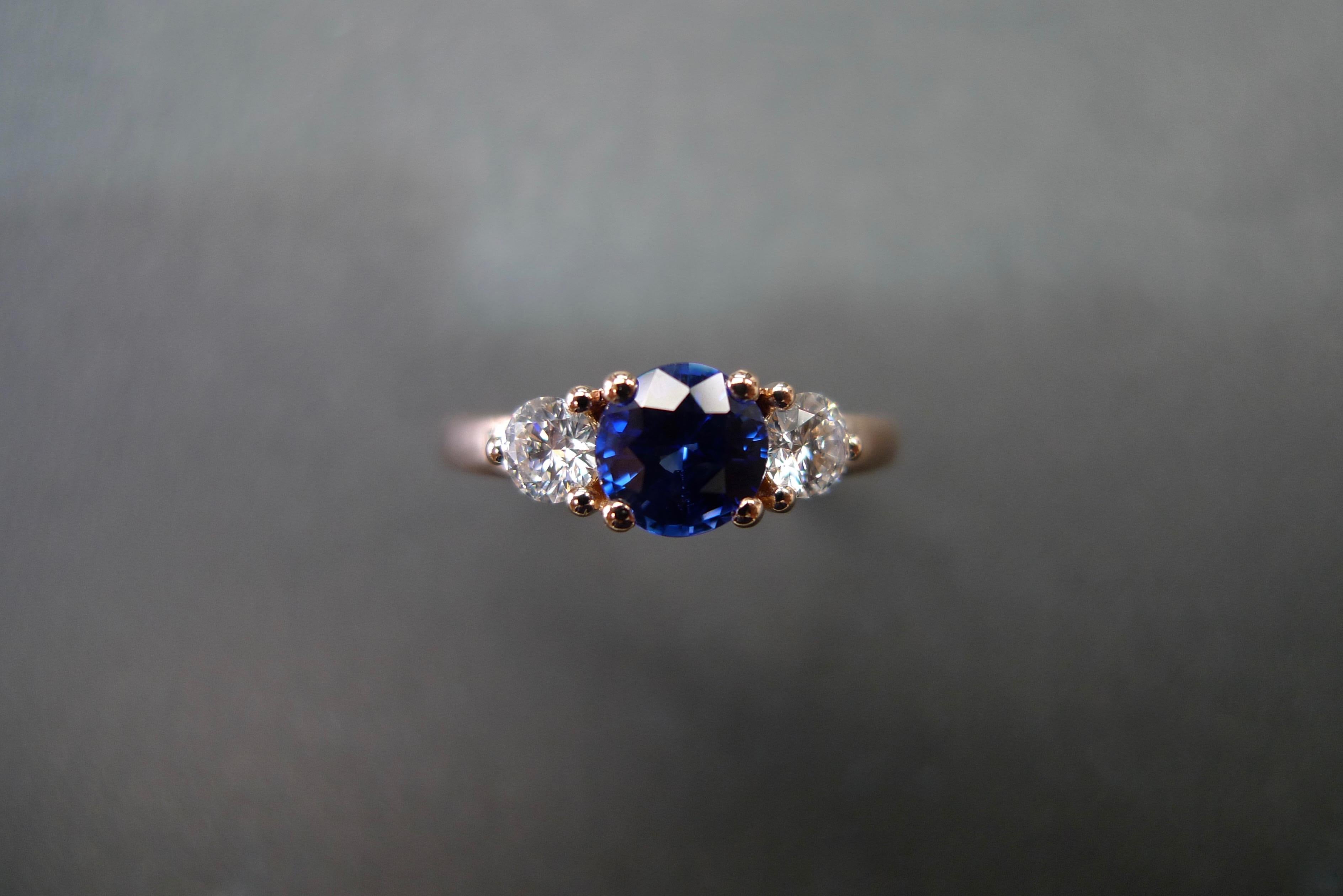 For Sale:  Three-Stone Ring with Blue Sapphire and Round Brilliant Cut Diamond in Rose Gold 6