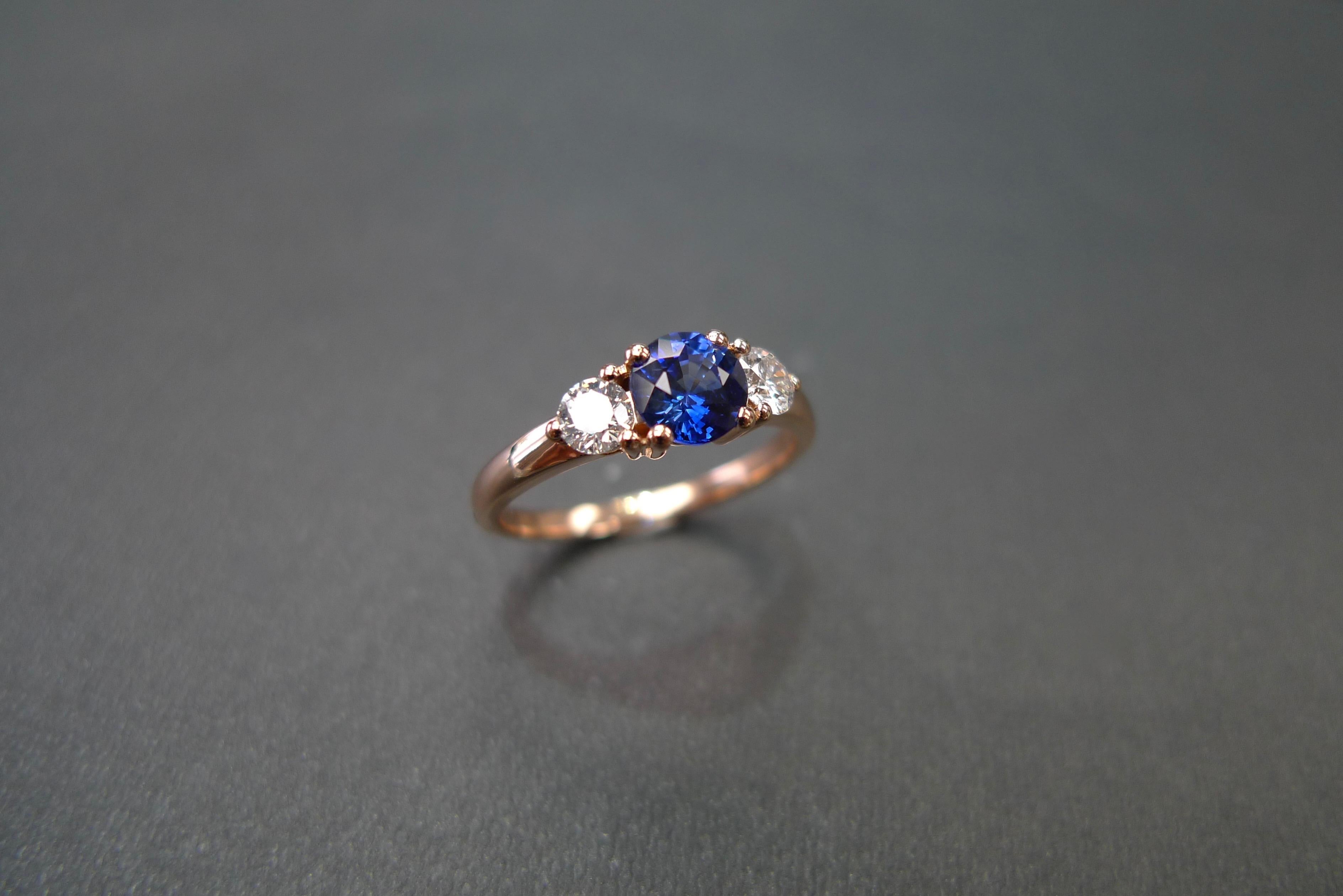 For Sale:  Three-Stone Ring with Blue Sapphire and Round Brilliant Cut Diamond in Rose Gold 7