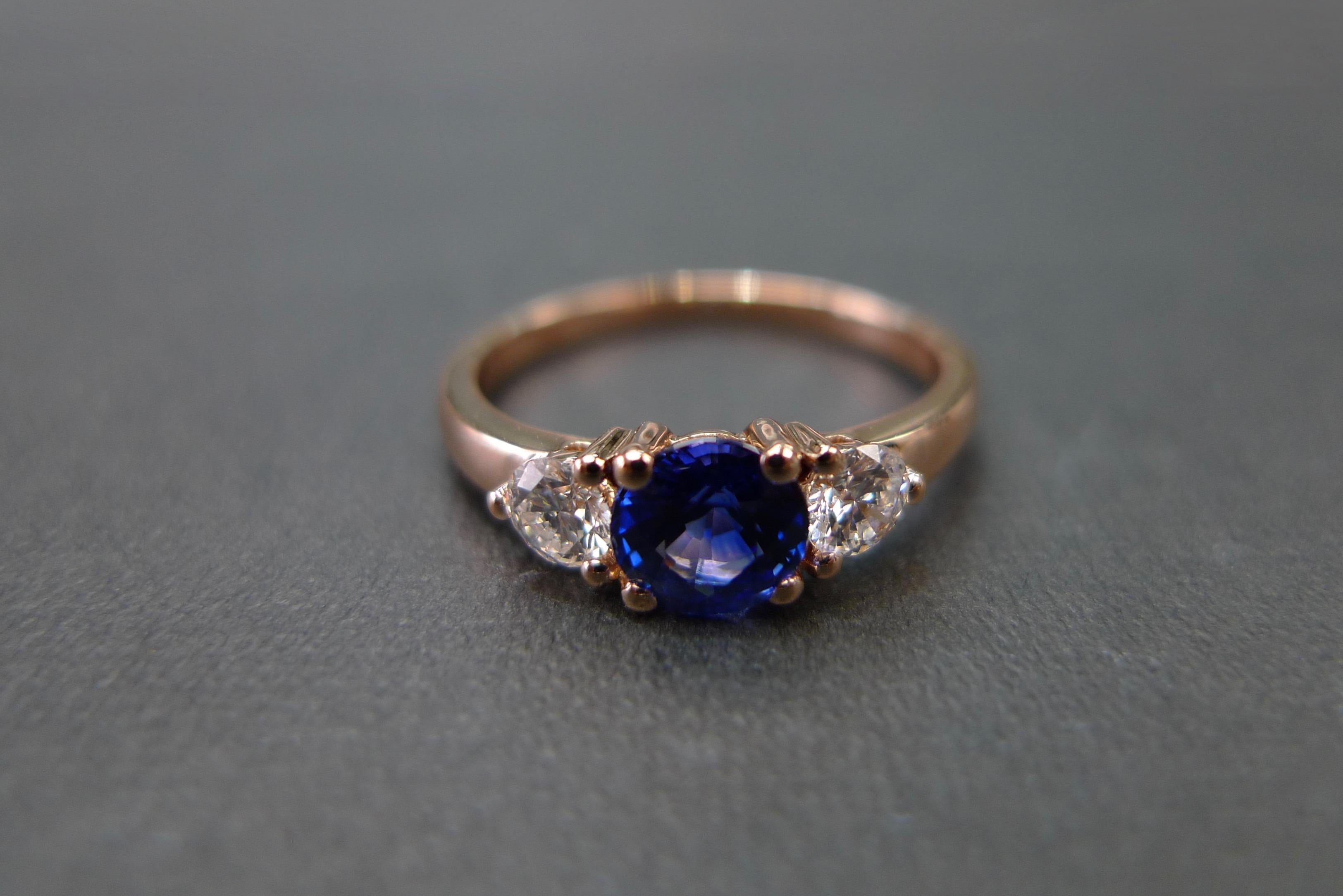 For Sale:  Three-Stone Ring with Blue Sapphire and Round Brilliant Cut Diamond in Rose Gold 8