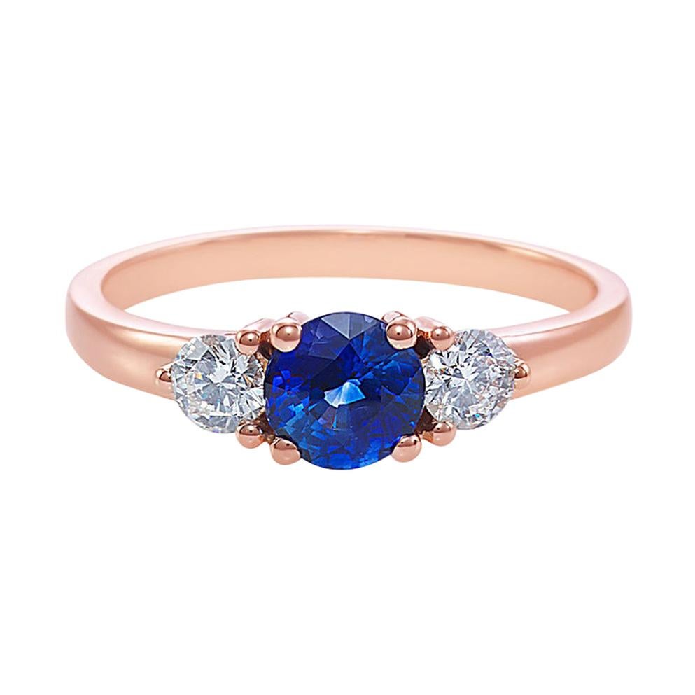 For Sale:  Three-Stone Ring with Blue Sapphire and Round Brilliant Cut Diamond in Rose Gold