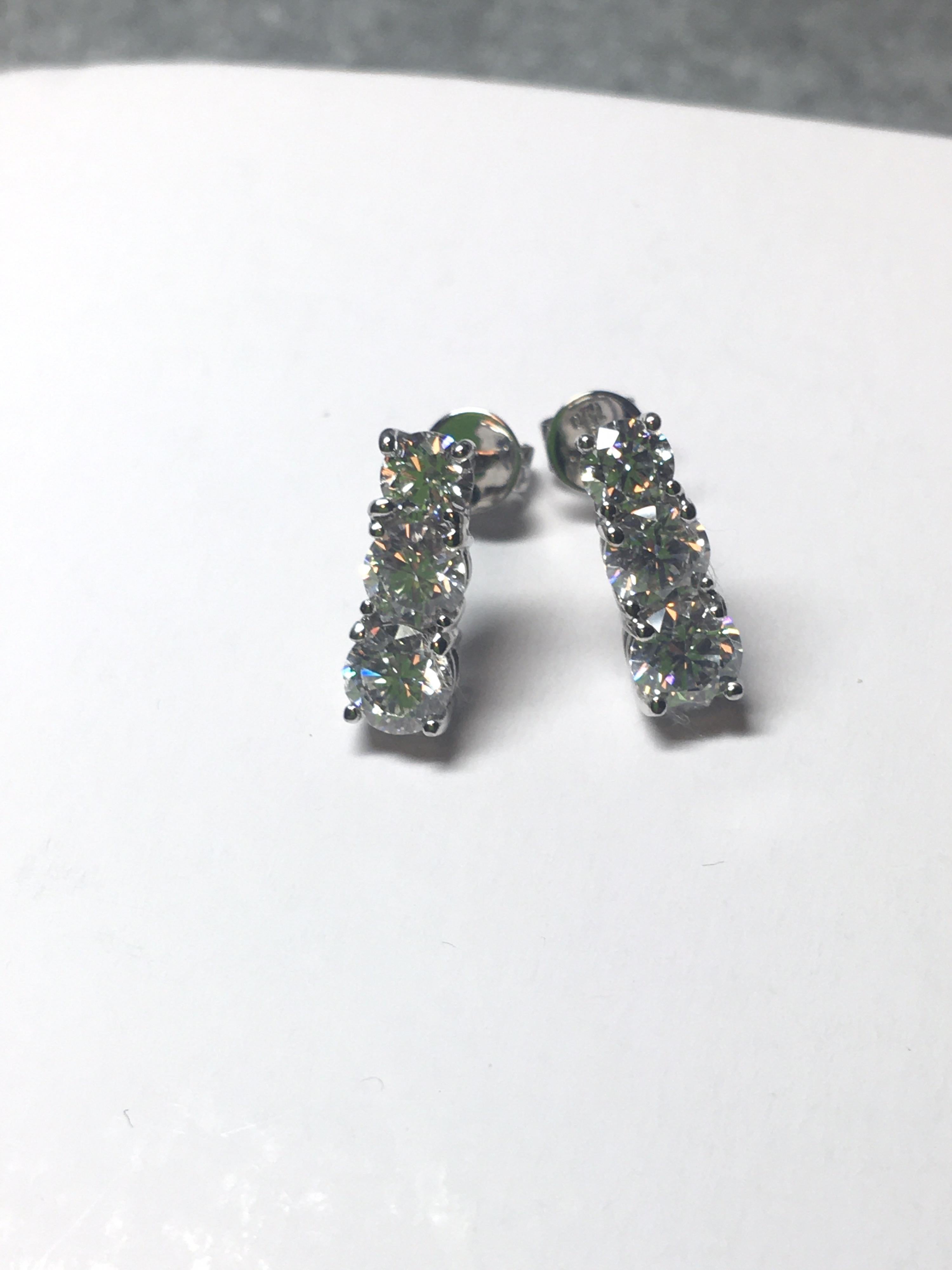 three stone diamond drop earrings