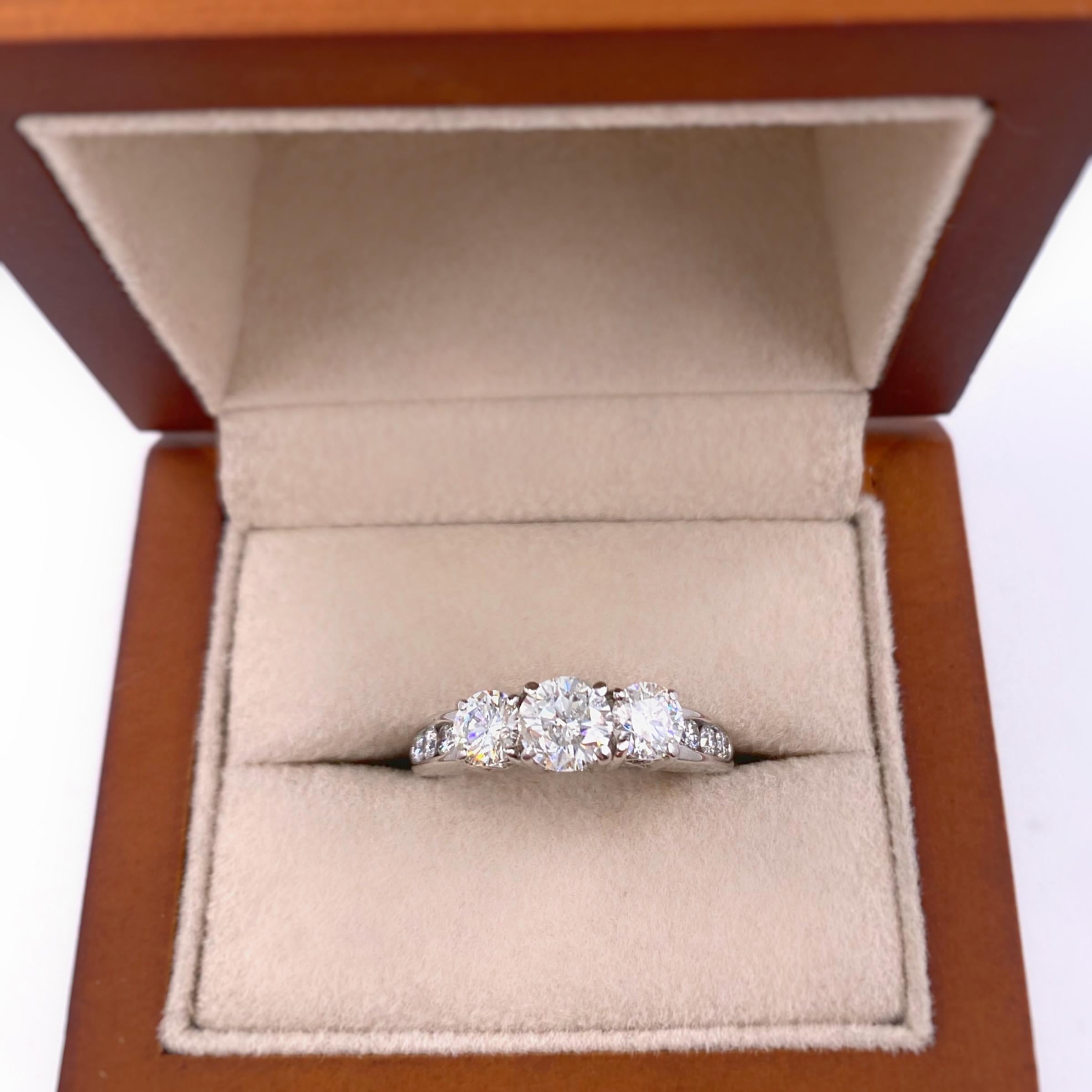 Three-Stone Diamond Engagement Ring
Style:  Past Present Future Engagement Ring
Metal:  14kt White Gold
Size:  6 - sizable
TCW:  1.40 tcw
Main Diamond:  Round Brilliant Diamond 0.60 cts
Color & Clarity:  G - H / SI2 - SI3
Accent Diamonds:  2 Round