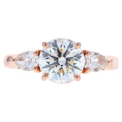 Three-Stone Round Diamond Engagement Ring with Pear Shaped Side Stones