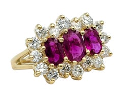 Three Stone Ruby Split Shank Ring with Diamond Halo in 14 Karat Yellow Gold