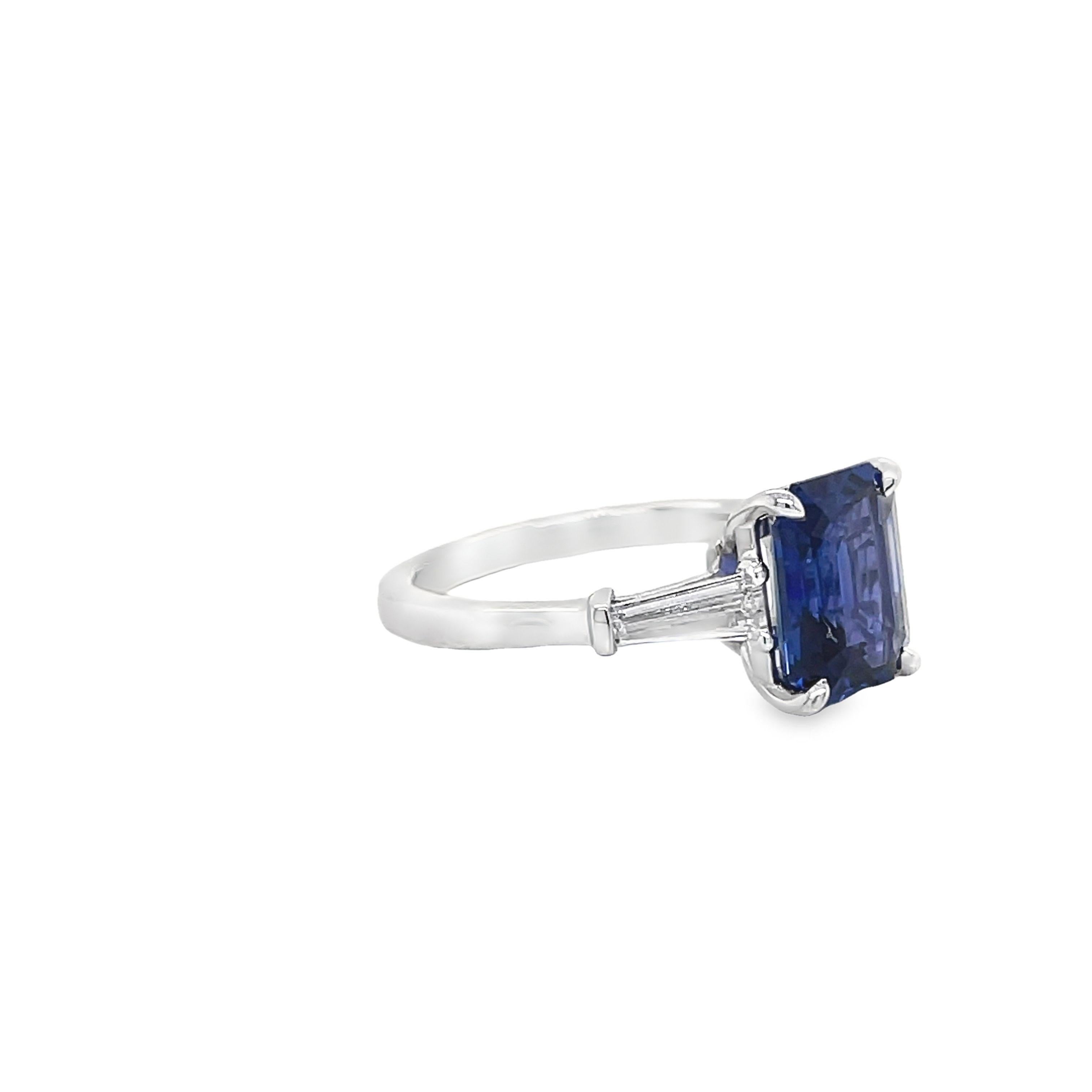 Ring contains one GIA certified emerald cut sapphire 3.23ct and 2 side baguette diamonds 0.45tcw. Sapphire and diamonds are mounted in a handmade basket prong setting. Sapphire originates from Sri Lanka. Diamonds are G in color and VS2 in clarity.