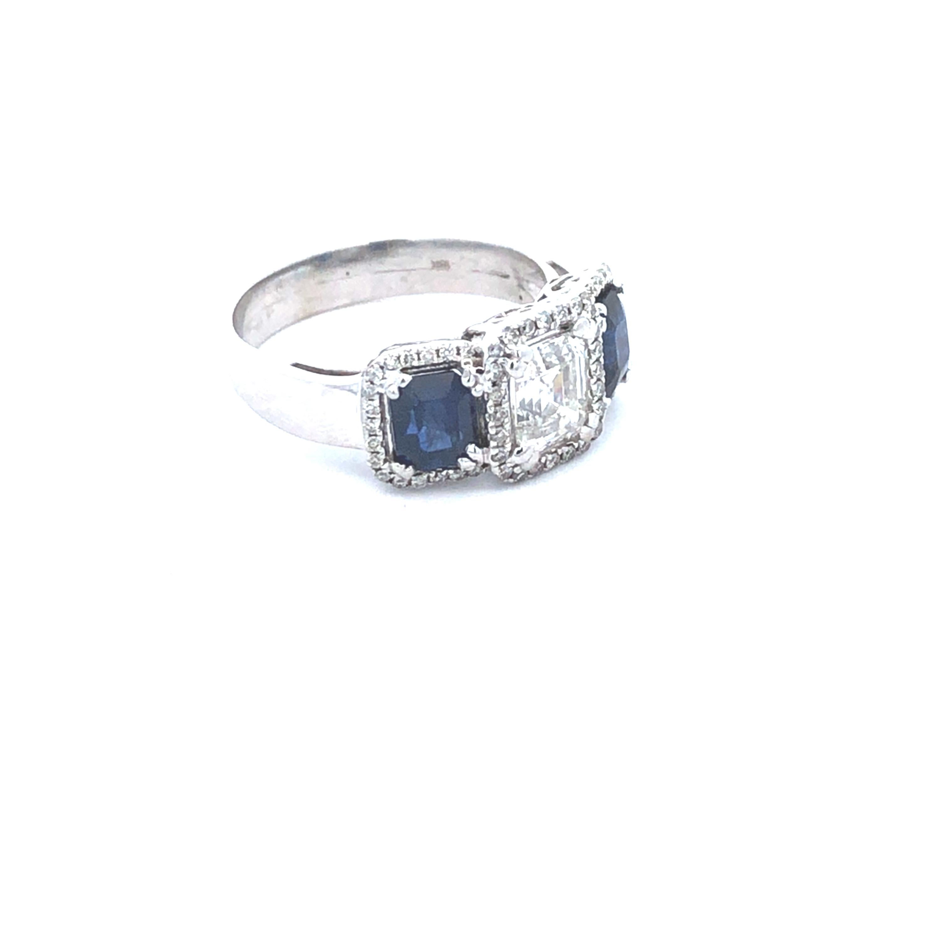 This exquisite ring is a harmonious blend of elegance and modern design, crafted in premium 18K white gold to showcase its timeless beauty. Its polished band provides a luxurious foundation for a stunning arrangement of diamonds and sapphires that