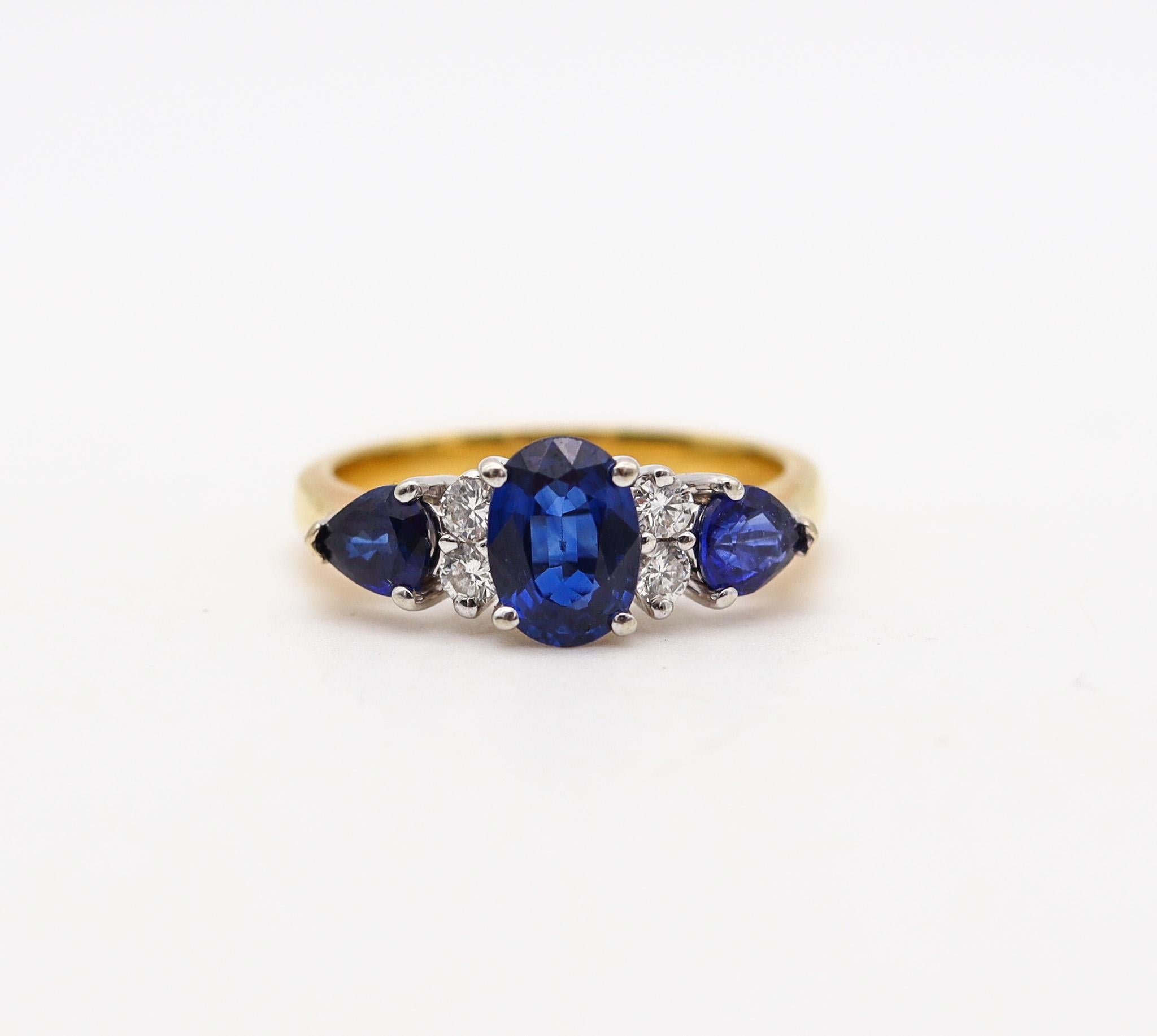 Three stone setting ring with sapphires designed by Spark Studio.

A beautiful ring, created in Virginia United states at the Spark Studio. This three gemstones setting ring has been crafted in solid yellow and white gold of 18 karats with high
