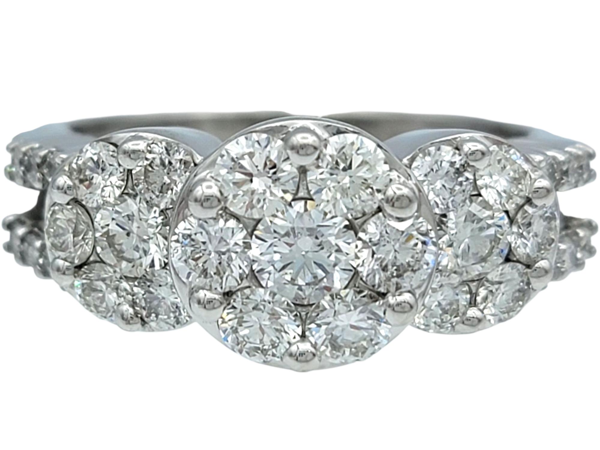 Ring Size: 7

This striking diamond cluster ring is a bold and brilliant piece, crafted in gleaming 18 karat white gold. The top of the ring is encrusted with a dazzling array of round brilliant cut diamonds, each one closely set to form a seamless,
