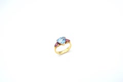 Three-Stoned Blue Topaz Flanked with Pink Tourmaline Yellow Gold Ring