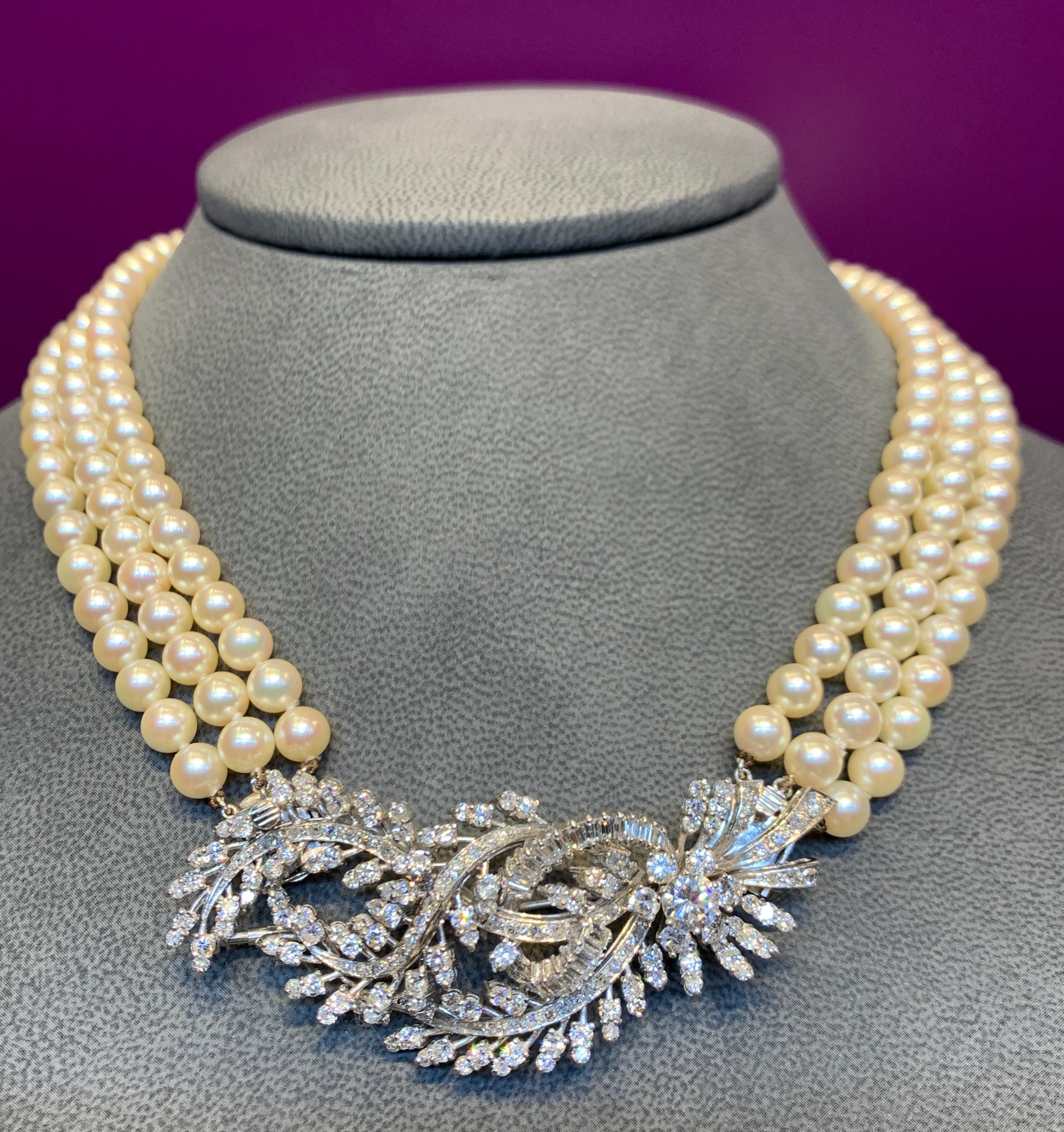 Three Strand Pearl & Diamond Necklace 
Center diamond element is convertible to a diamond brooch. 
168 small round cut diamonds
21 baguette cut diamonds 
6 medium round cut diamonds 
1 large round cut diamond 
Total Diamond weight approximately 5