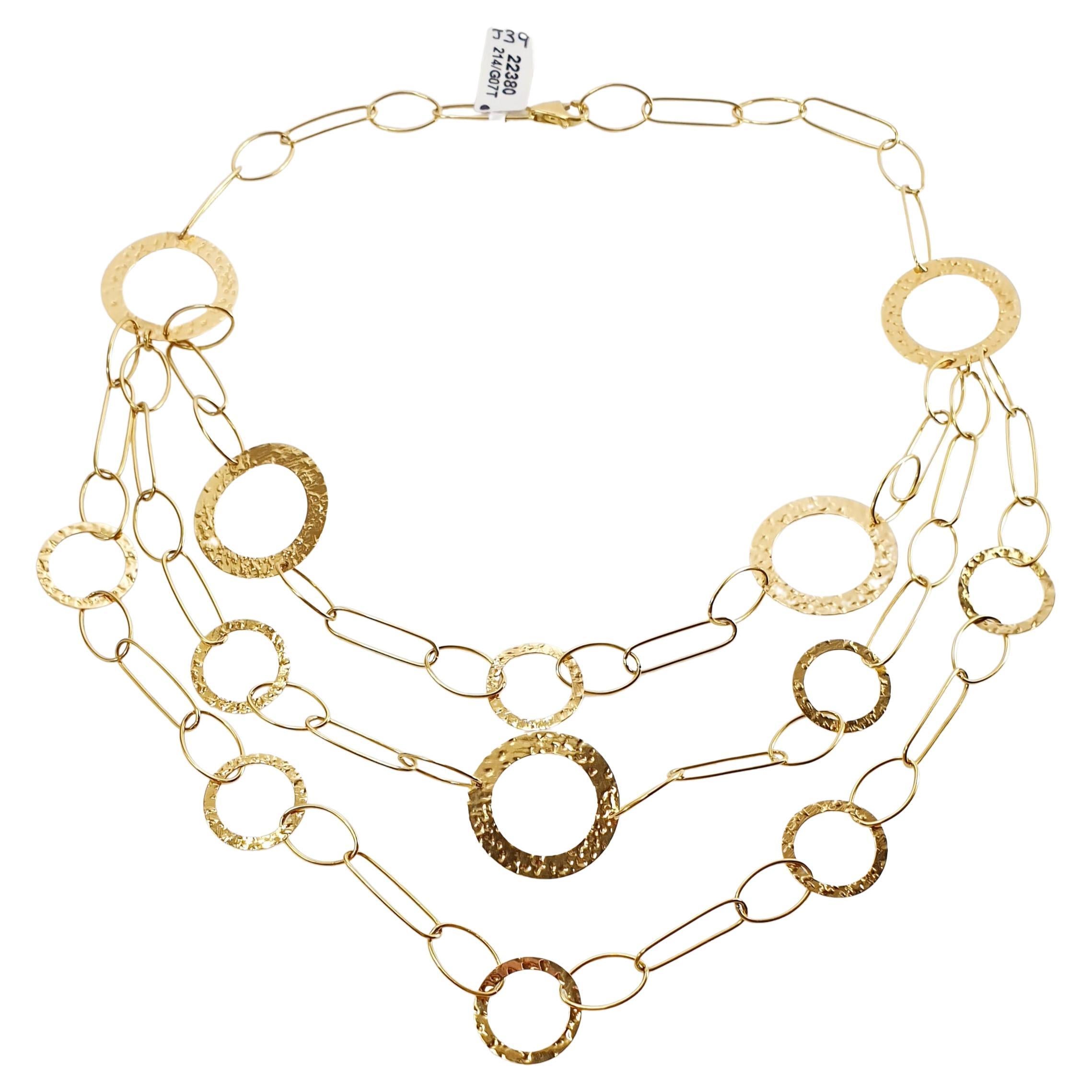 Three-Strand Yellow Gold Necklace with Rings of Different Sizes For Sale