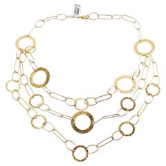 Three-Strand Yellow Gold Necklace with Rings of Different Sizes