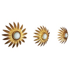 Tre lampade a stella Sunburst in metallo dorato