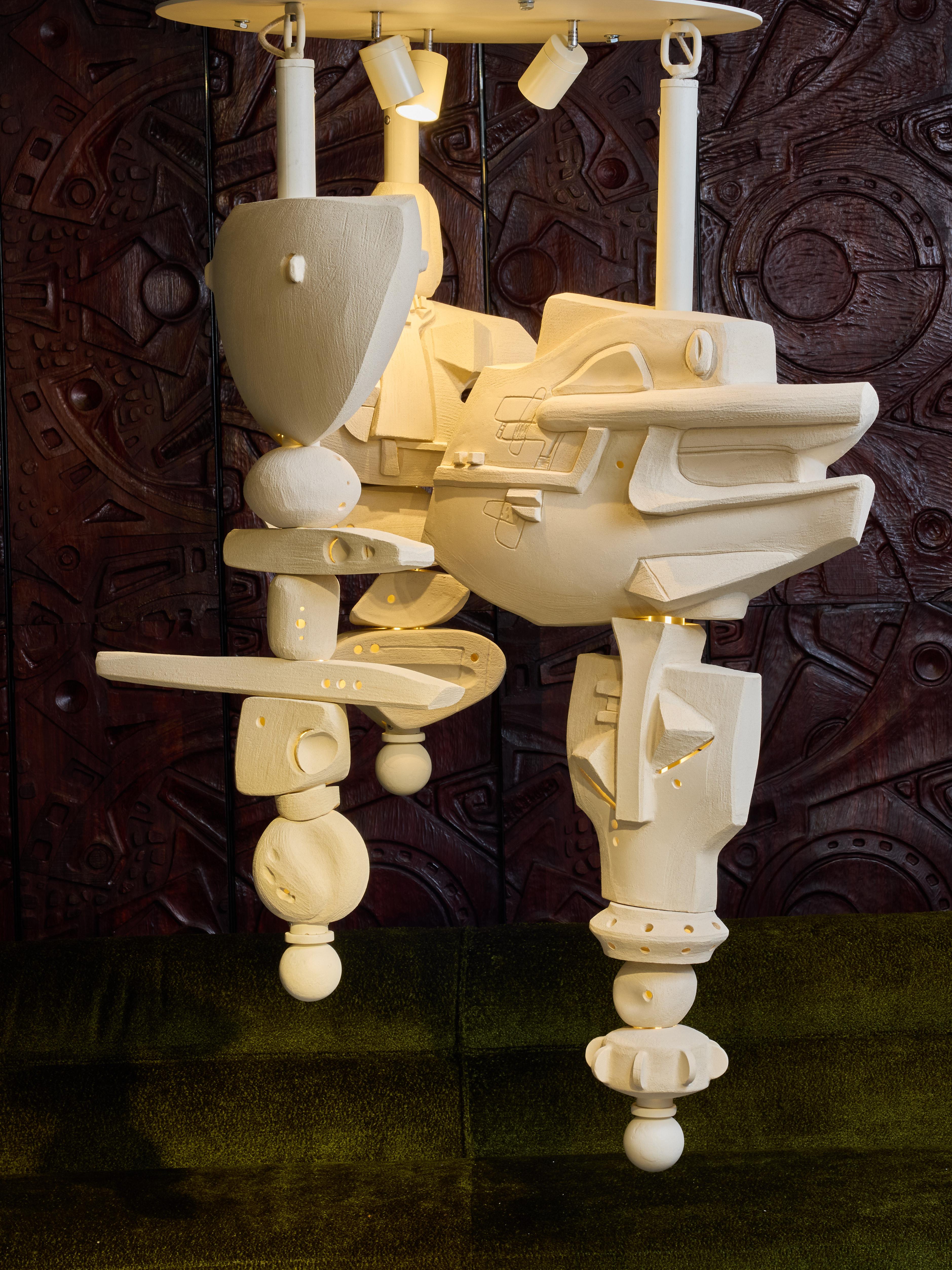 Stunning piece by Olivia Cognet, new fixture made of unique ceramic pieces of different sizes assembled vertically as totems.

The ceramics are threaded on hollow metal tubes, each attached to a ceiling plate. All the metal parts are painted in