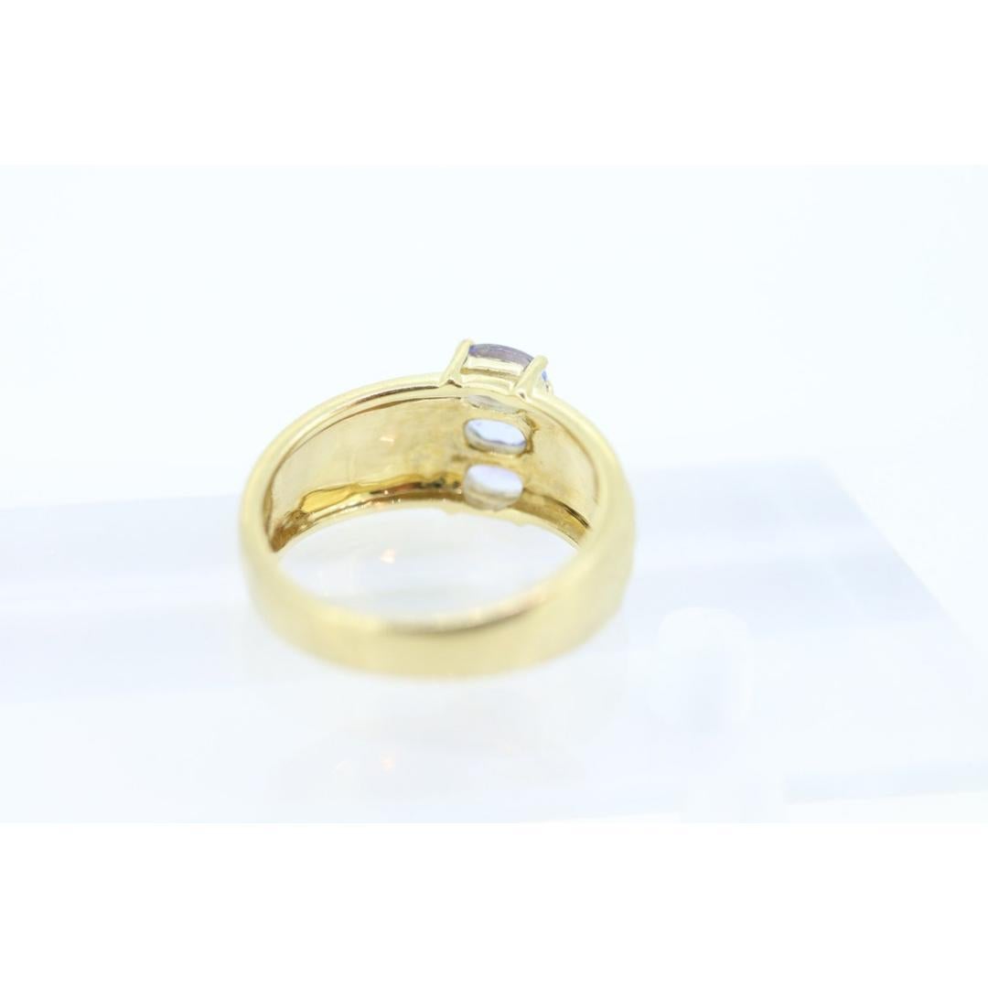 Anello con tre tanzaniti a grappolo. Anello largo ovale con tripla tanzanite 14k. Tanzanite in vendita 3