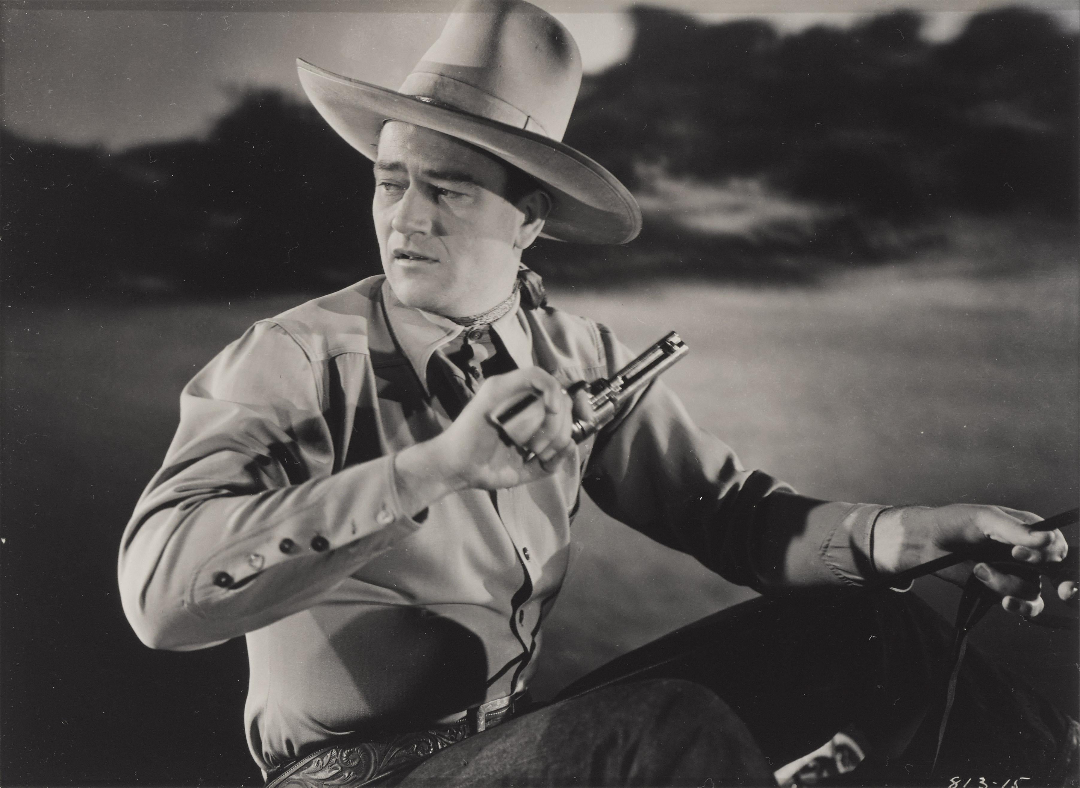 Original photographic production still for John Wayne's 1939 Western Three Texas Steers.
This film was directed by George Sherman.
This piece is conservation framed with UV plexiglass in an Obeche wood frame with acid free card mounts and UV