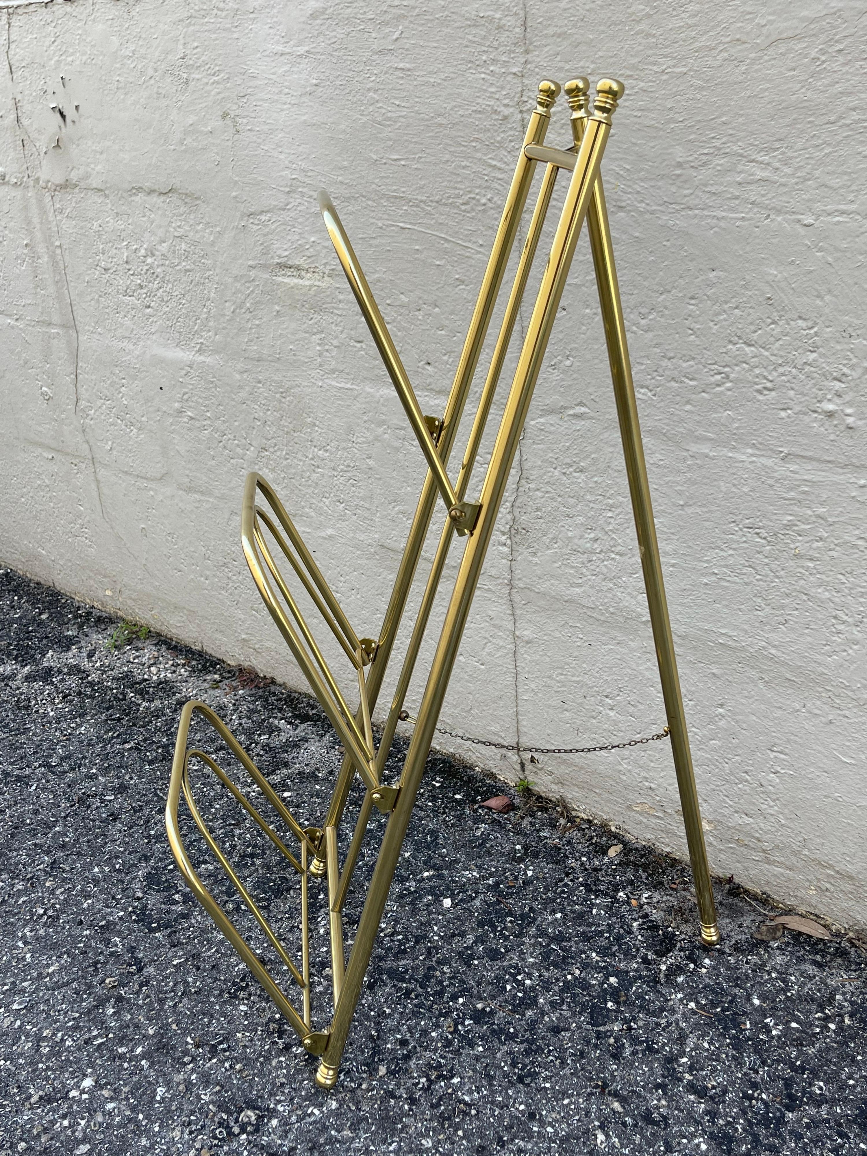 Three tier folding brass magazine rack. Would also be great for folded towels in your bathroom.