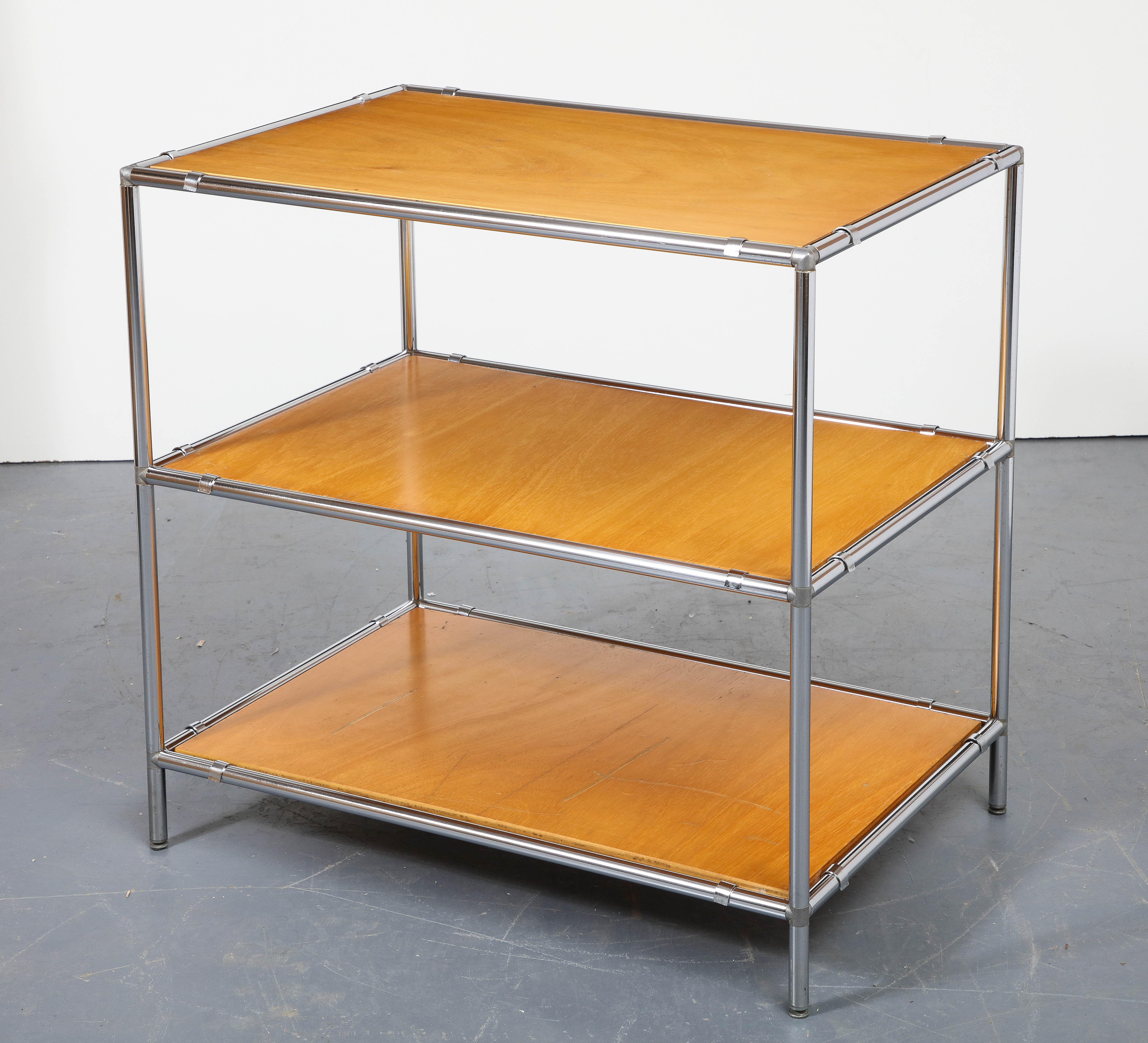 Three-Tier chrome and wood Etagere, Italy, 20th century. 

Sleek etagere consists of a tubular chrome frame and three tiers of wooden shelves.