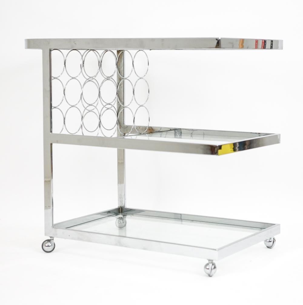 Chrome bar or serving cart with three glass shelves and individual bottle holders.