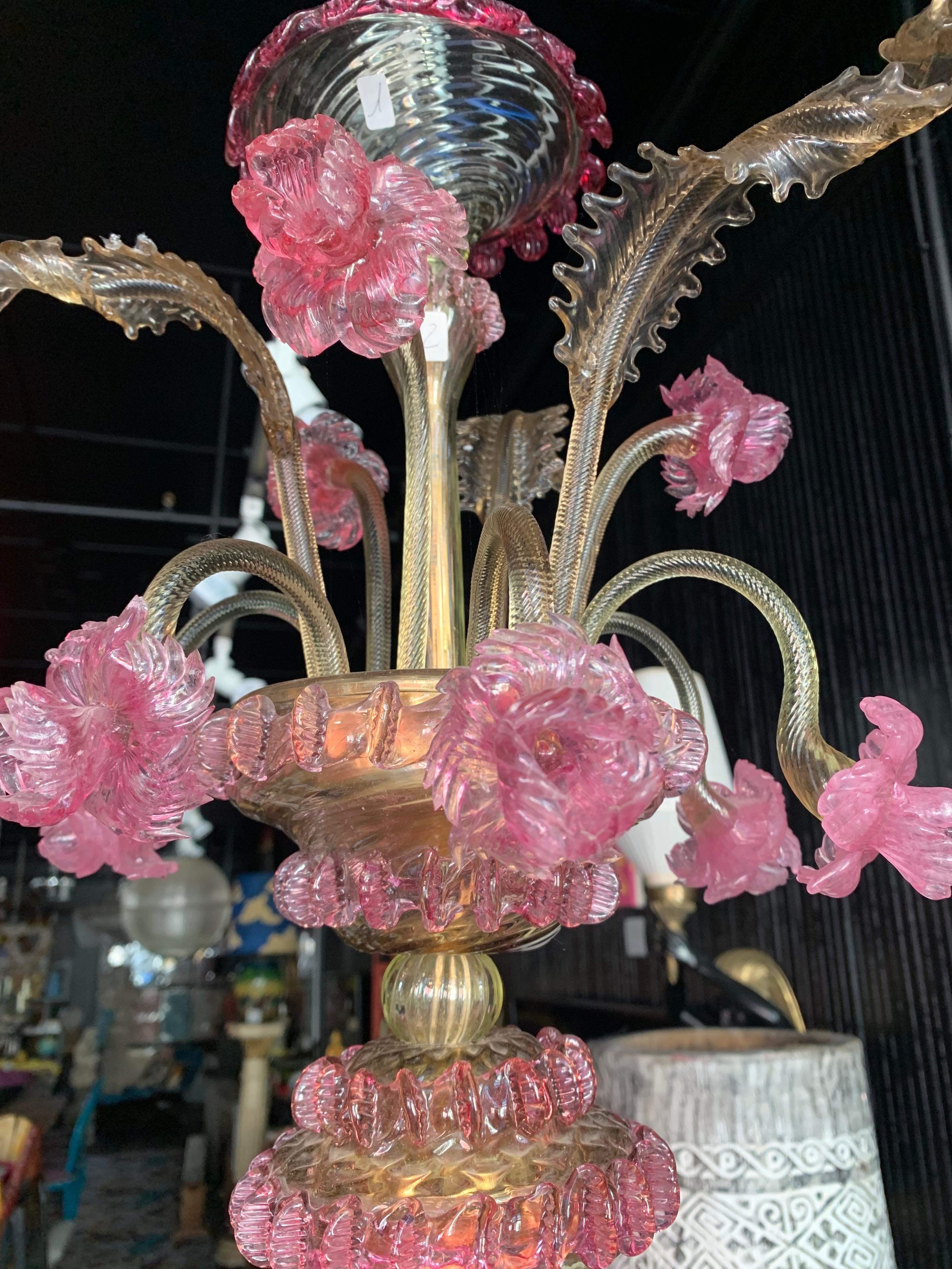 This stunning Rezzonico collection by Simone Cenedese Murano mouth-blown chandelier is a beautiful example of fine artistry meeting function. Created in the late 60’s to early 70’s this beautiful pink and smoked pale green chandelier features some