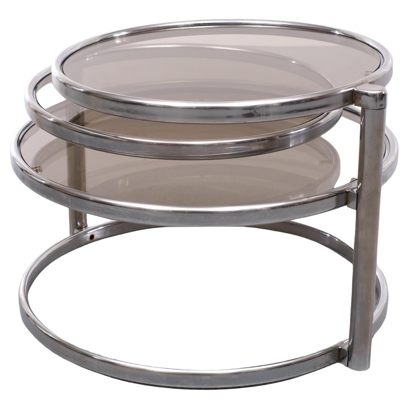 Very nice Three tier coffee table. Chrome base, comes with its original 
smoked glass top. Very useful when there is not much space. 
Pull out from 60 cm to 169 cm.