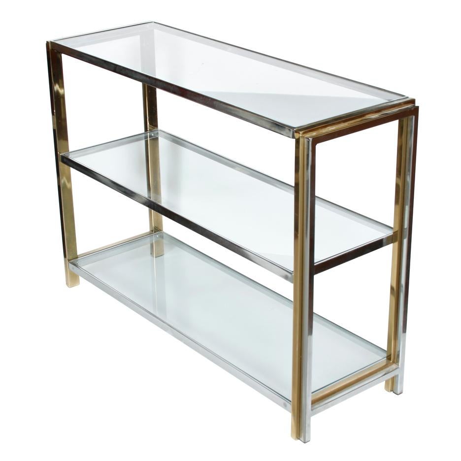 Mid-Century Modern three-tier console table of chrome, brass and glass.