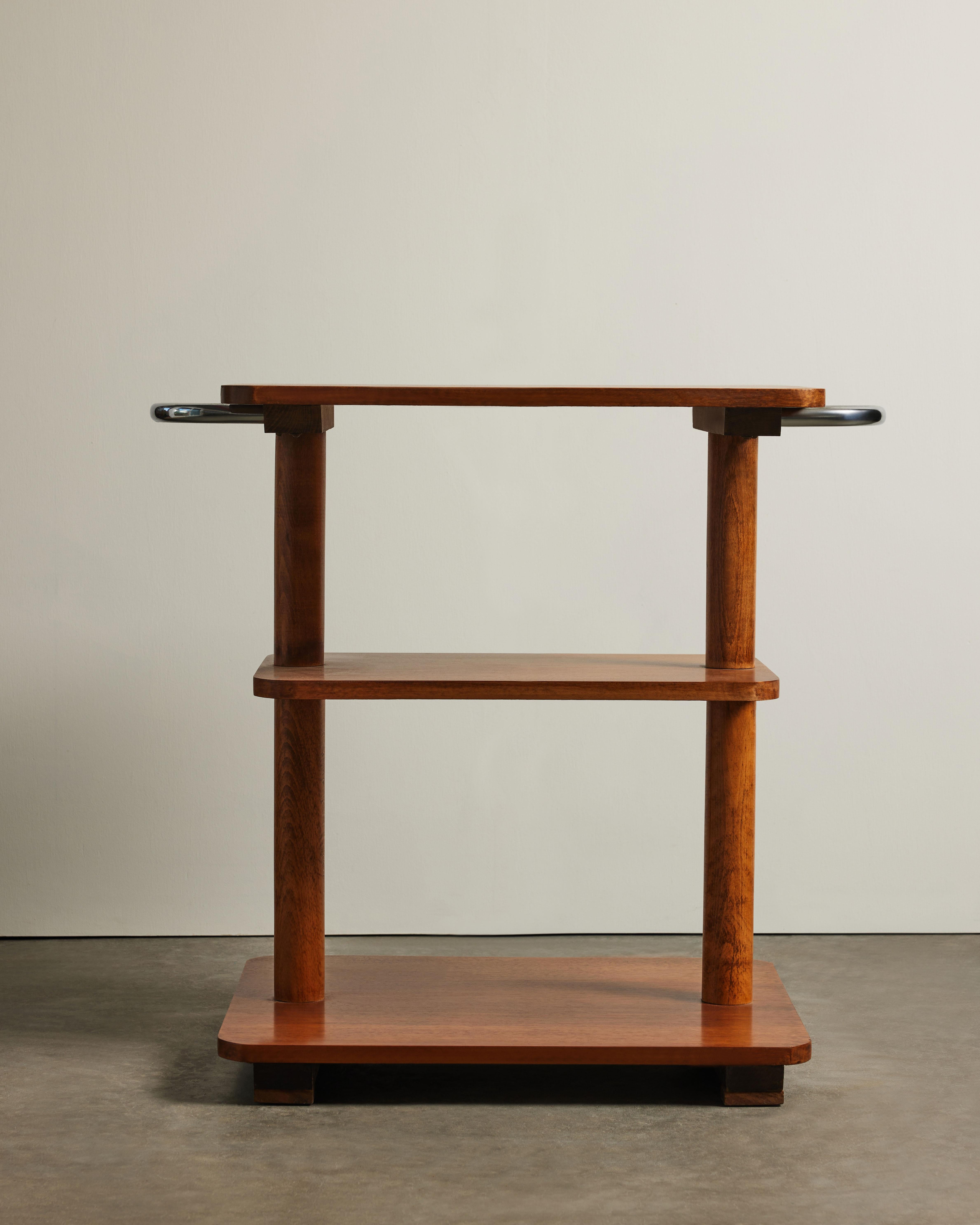 Solid three tier side table made of beautiful, warm elm. Chrome handles at each side.