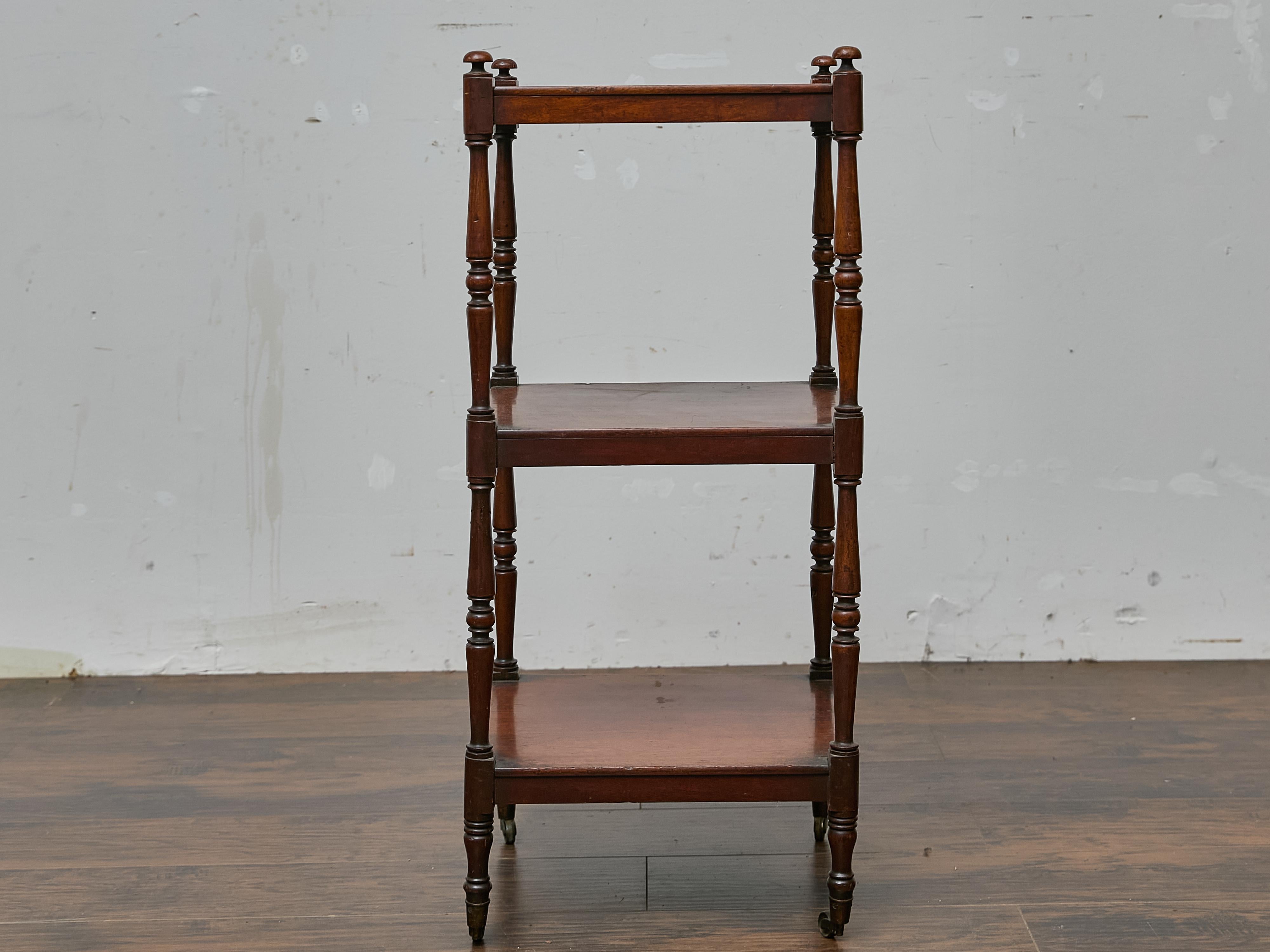 19th Century Three-Tier English Mahogany Étagère with Turned Supports and Casters For Sale