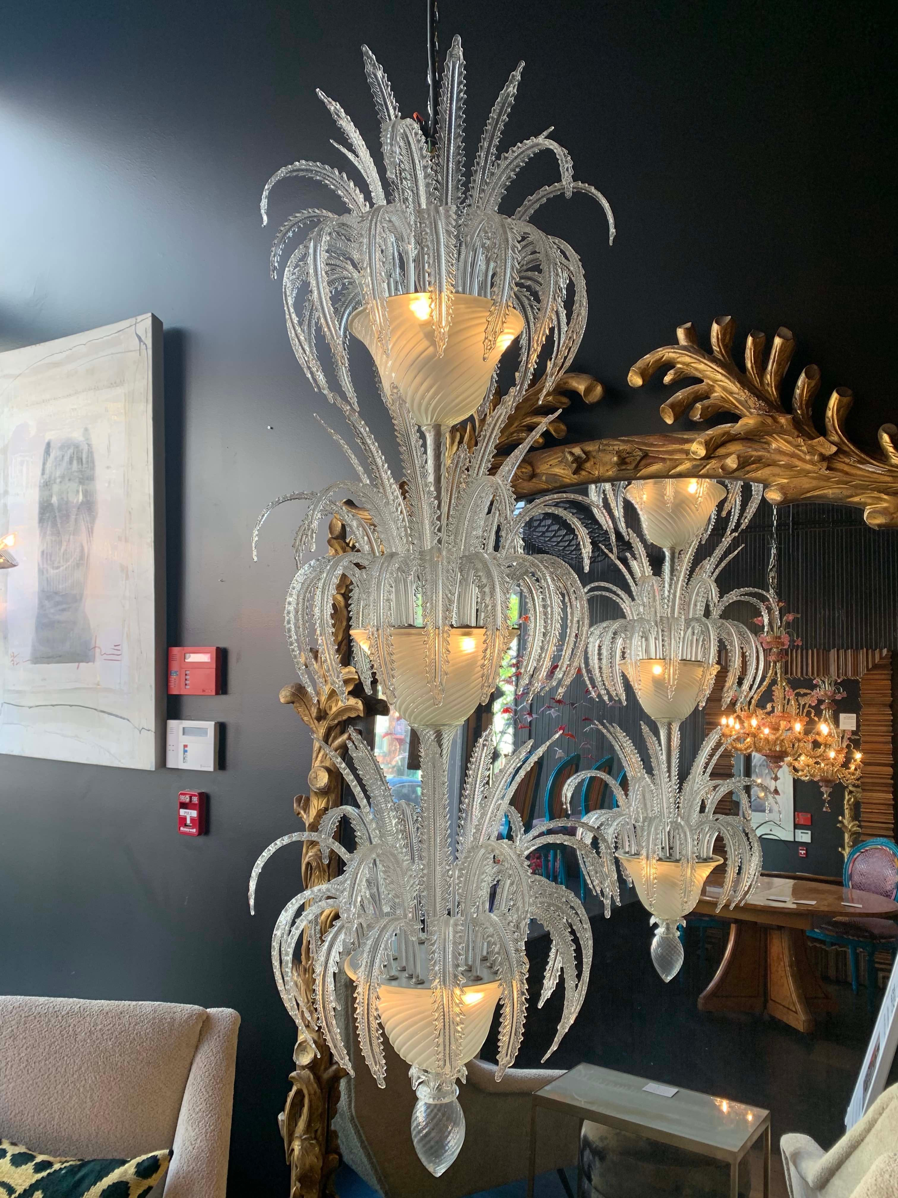 This exceptional Salviati Murano chandelier is a stunning example of lighting as art. The thistle-like leaves seem as though covered in ice. This fixture measures 62’ long and would be incredible over a center foyer table or in a dramatic stairwell