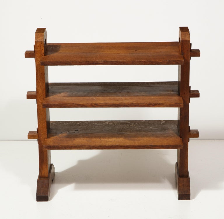 Three-Tier Oak Etagere, France, c. 1950s. 

This simple yet highly sophisticated etagere consists of a solid oak construction, handsome feet, hard-carved details, and three levels for storage and display. 