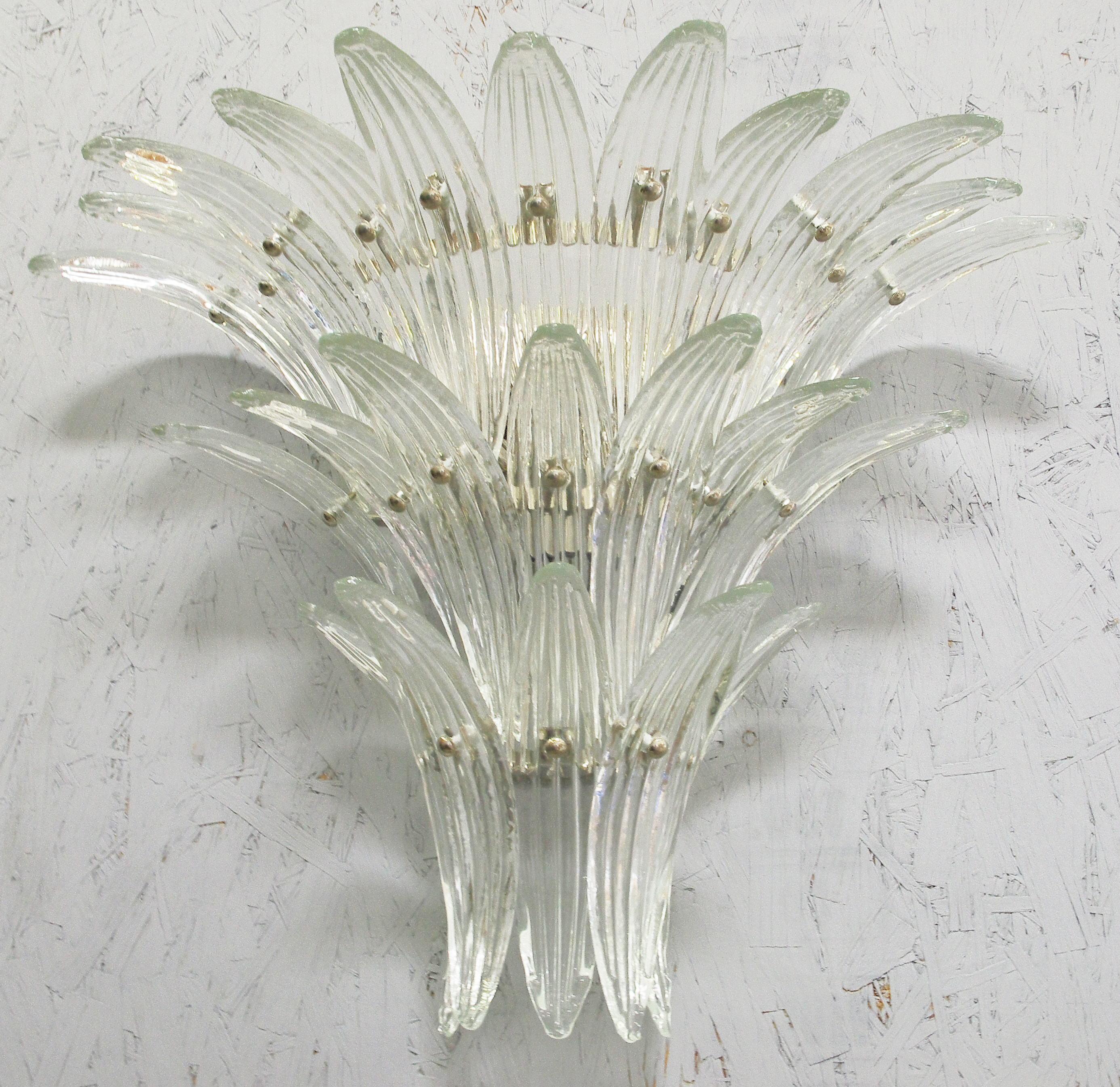 Italian Palmette wall light with 23 clear Murano glass leaves, mounted on chrome finish metal frame by Fabio Ltd / Made in Italy
3 lights / E12 or E14 type / max 40W each
Width: 27 inches / Height: 20 inches / Depth: 10 inches
Order only / This item