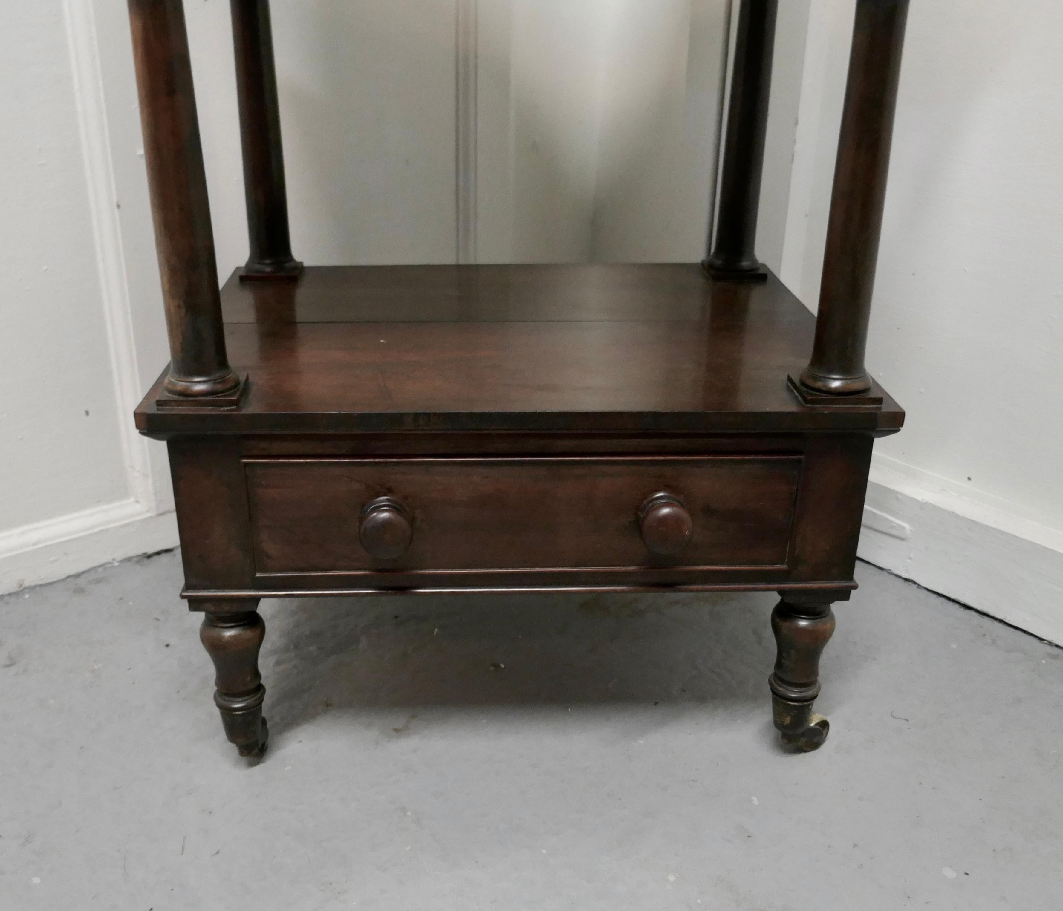 Three tier regency rosewood whatnot with drawer

This is a very good quality antique whatnot
The whatnot has three tiers with turned supports in each corner and beneath the bottom tier there is a useful drawer 
The four turned feet have the
