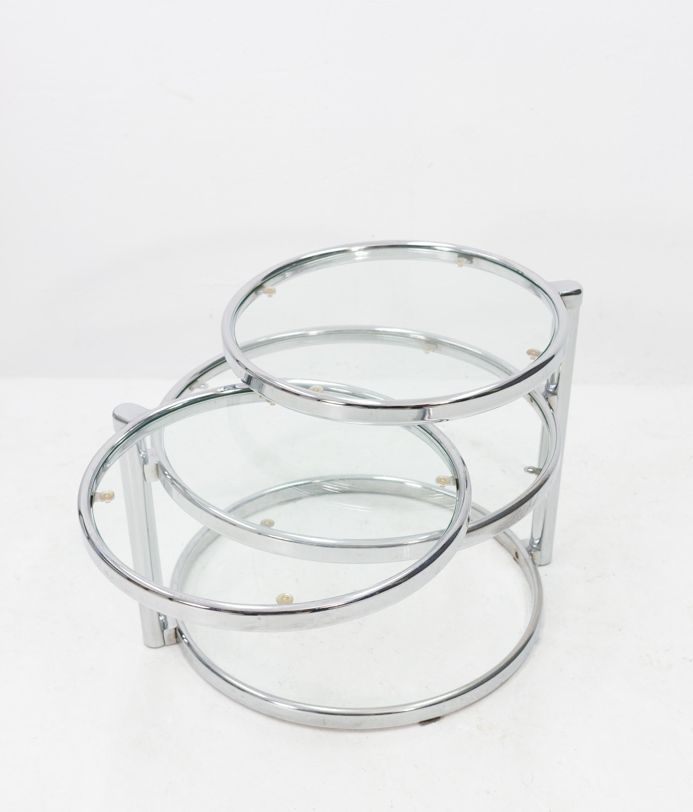 Very nice and useful coffee table. Three round tables in one. Chrome frame with glass surfaces.
1970s.