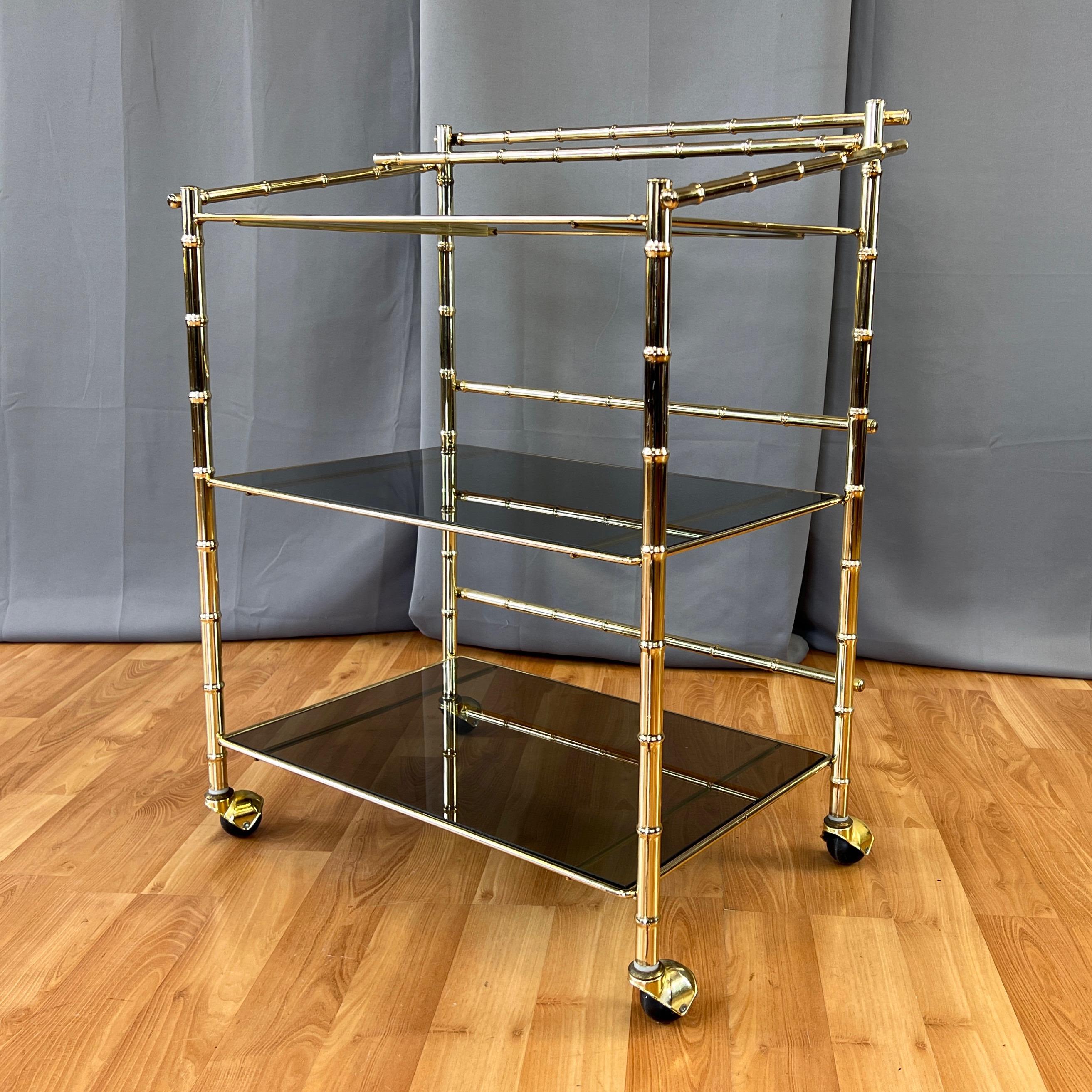 American Three-Tiered Brass Faux Bamboo and Smoked Glass Bar Cart, 1970s For Sale