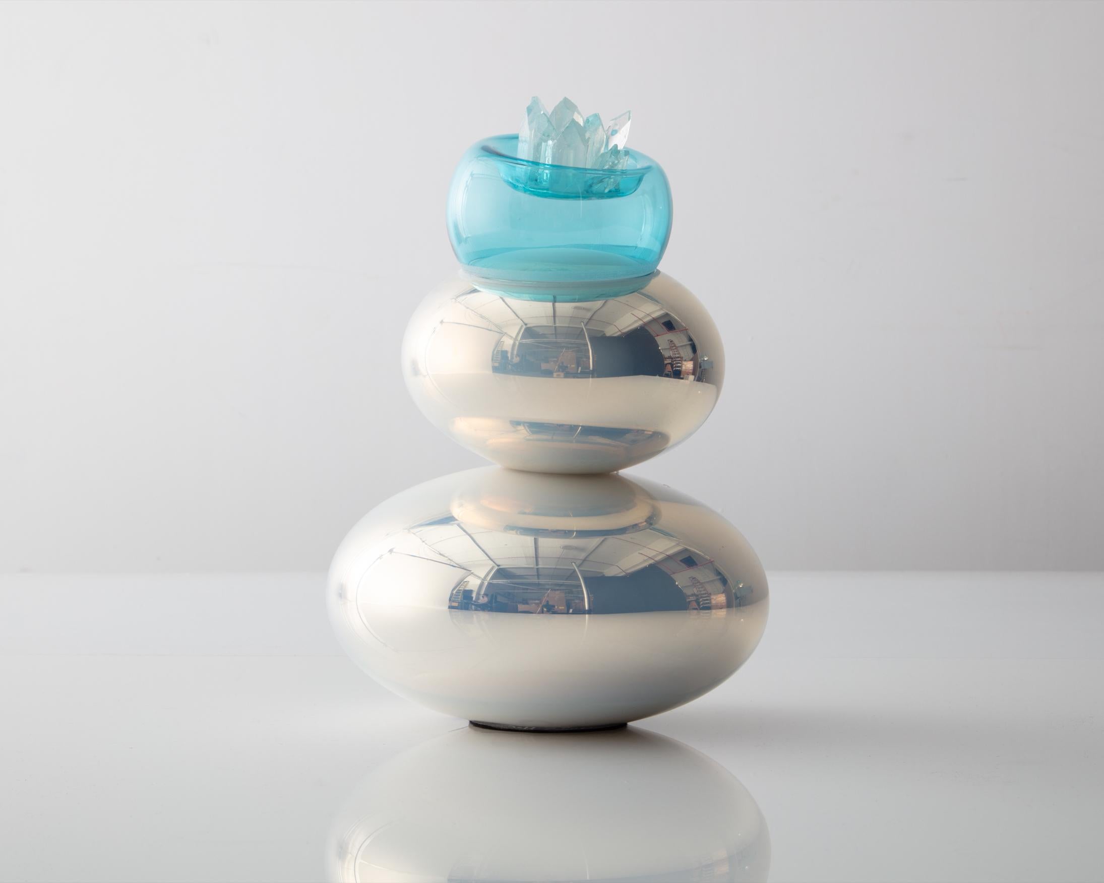 Three-tiered stacked bubble sculpture. Mirrored silver and turquoise applied glass crystals with felt pad. Designed and made by Jeff Zimmerman, USA, 2021.