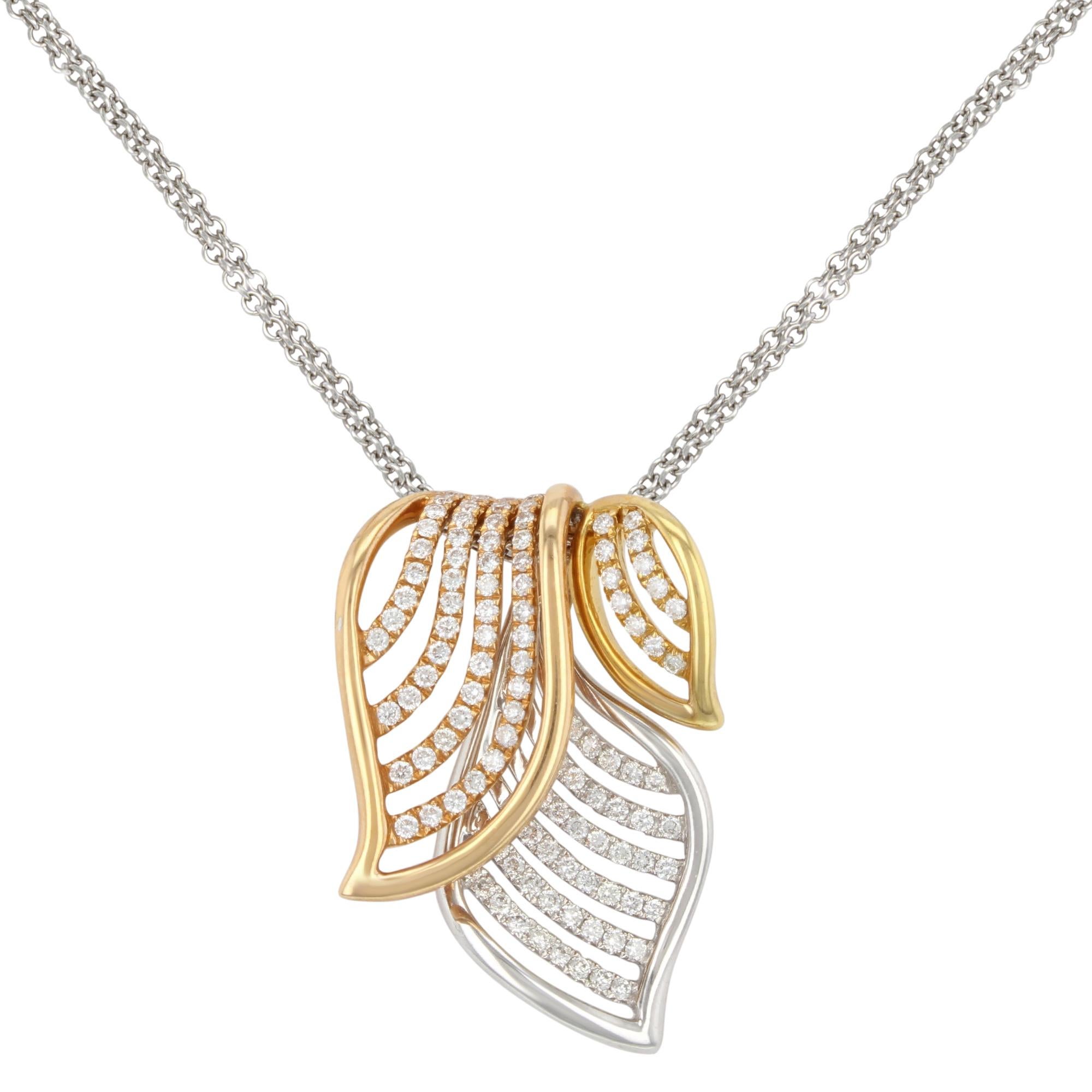 This stunning three tone diamond pendant necklace is a must have for your jewelry collection. Crafted in 18k white, yellow & rose gold and encrusted with 0.67 carat of dazzling round cut diamonds. Necklace length: 16.75