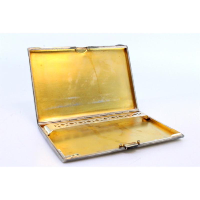 Description: Three-tone silver and gold cigarette case with gold interior and cut-out cigarette holder. Metal: Silver. Origin: French. Brand: Absent. Weight: 175.42 grams. Dimensions: 12cmx8cm. Content: 925/1000(Silver) 750/1000(Gold). Assay Mark: