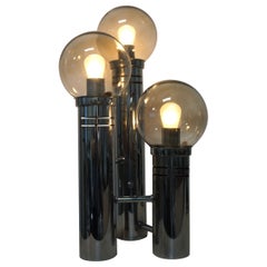 Three Transparent Glass Globe And Chrome Tier Table Lamp