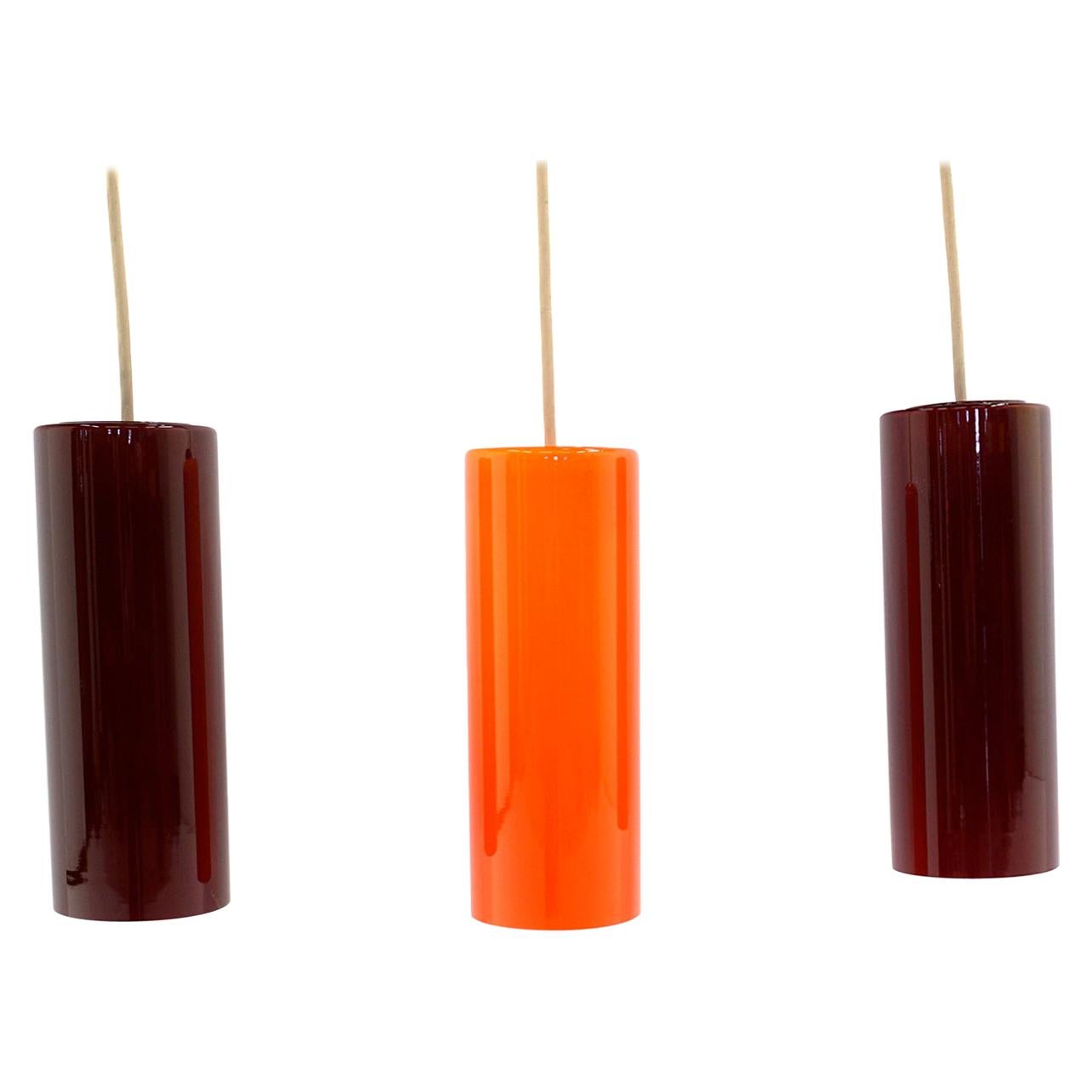 Three Tubular Glass Pendant Lights, Two Deep Red, One Orange, 1960s For Sale