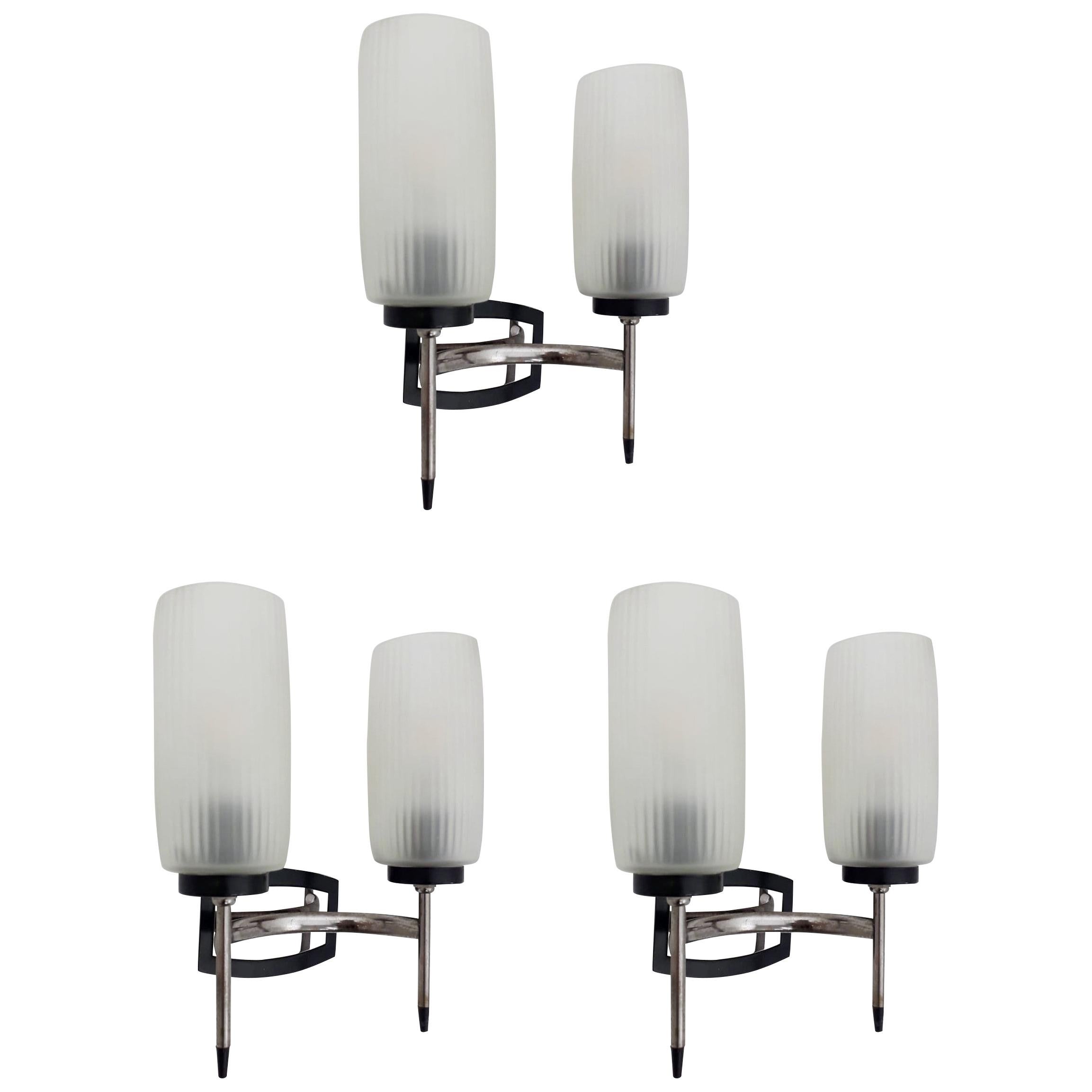Vintage Italian wall light with frosted glass cone diffusers mounted on nickel and black frame / Made in Italy, circa 1970s
2 lights / E12 or E14 type / max 40W each
Height: 10 inches / Width: 8.5 inches / Depth: 4 inches
3 in stock in Italy, price