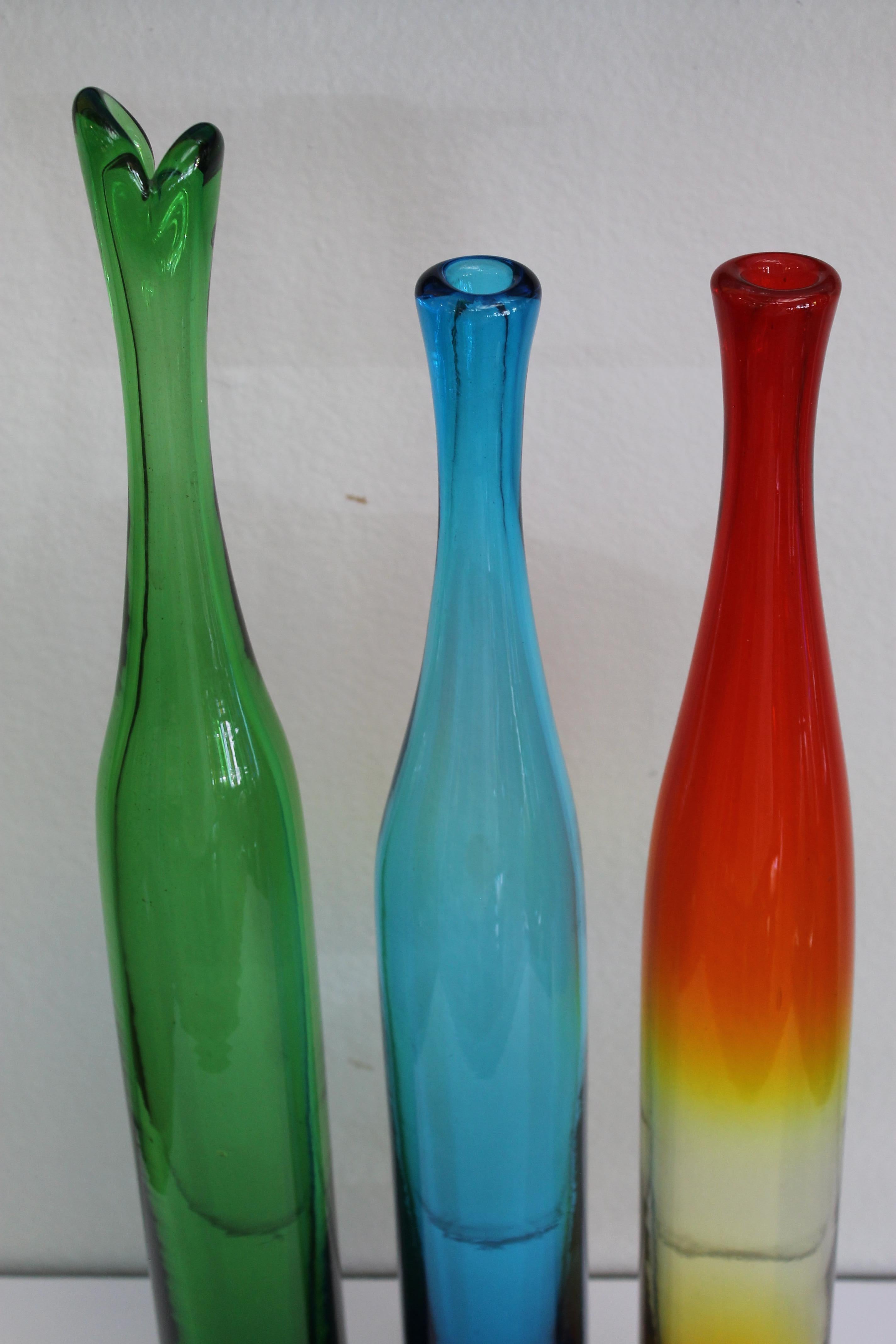 Three Joel Myers colored glass vases, model no. 6427, 1960s. Manufactured by Blenko. The tallest vase is 23.75